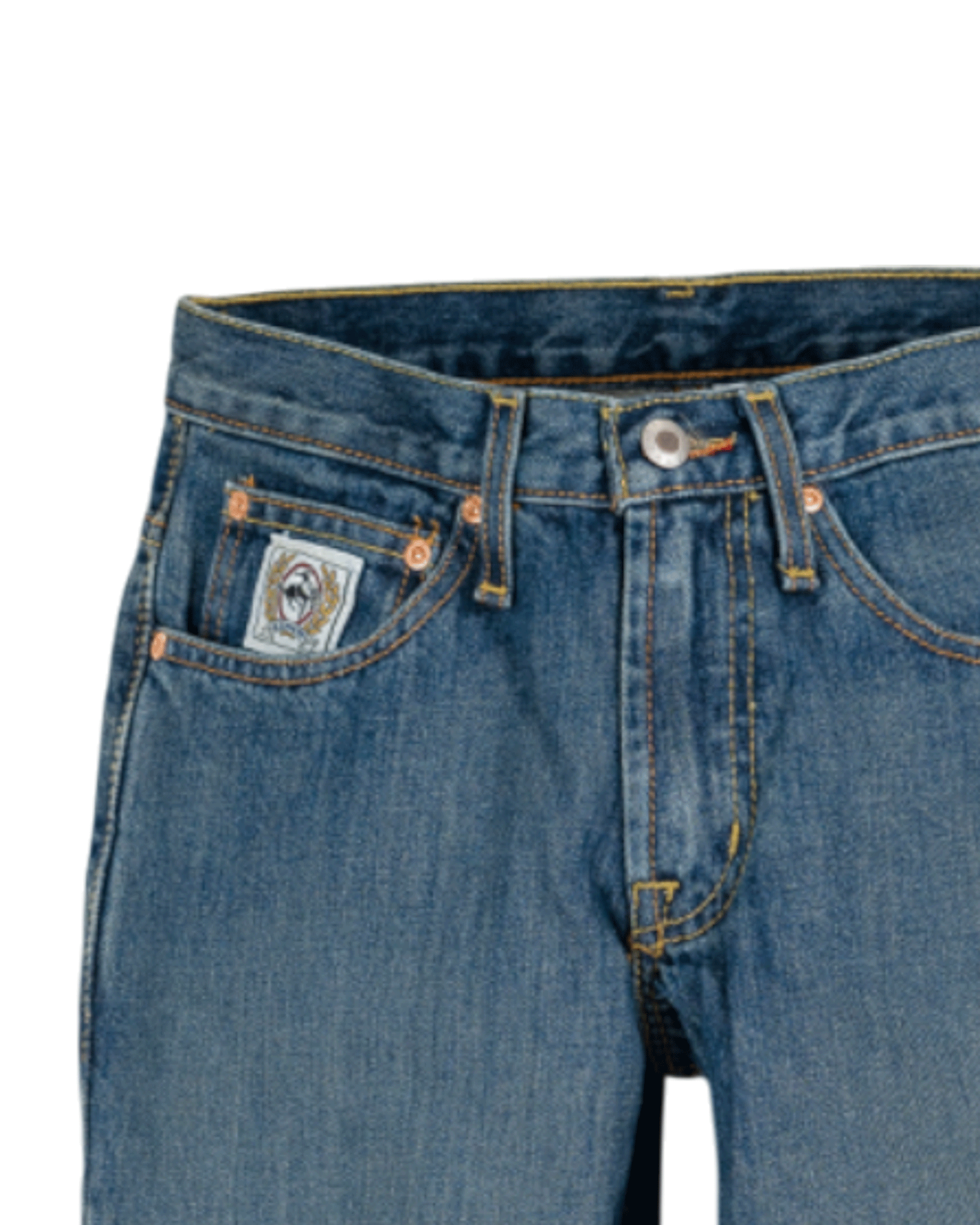 Close-up of blue jeans with a brand label on a white background