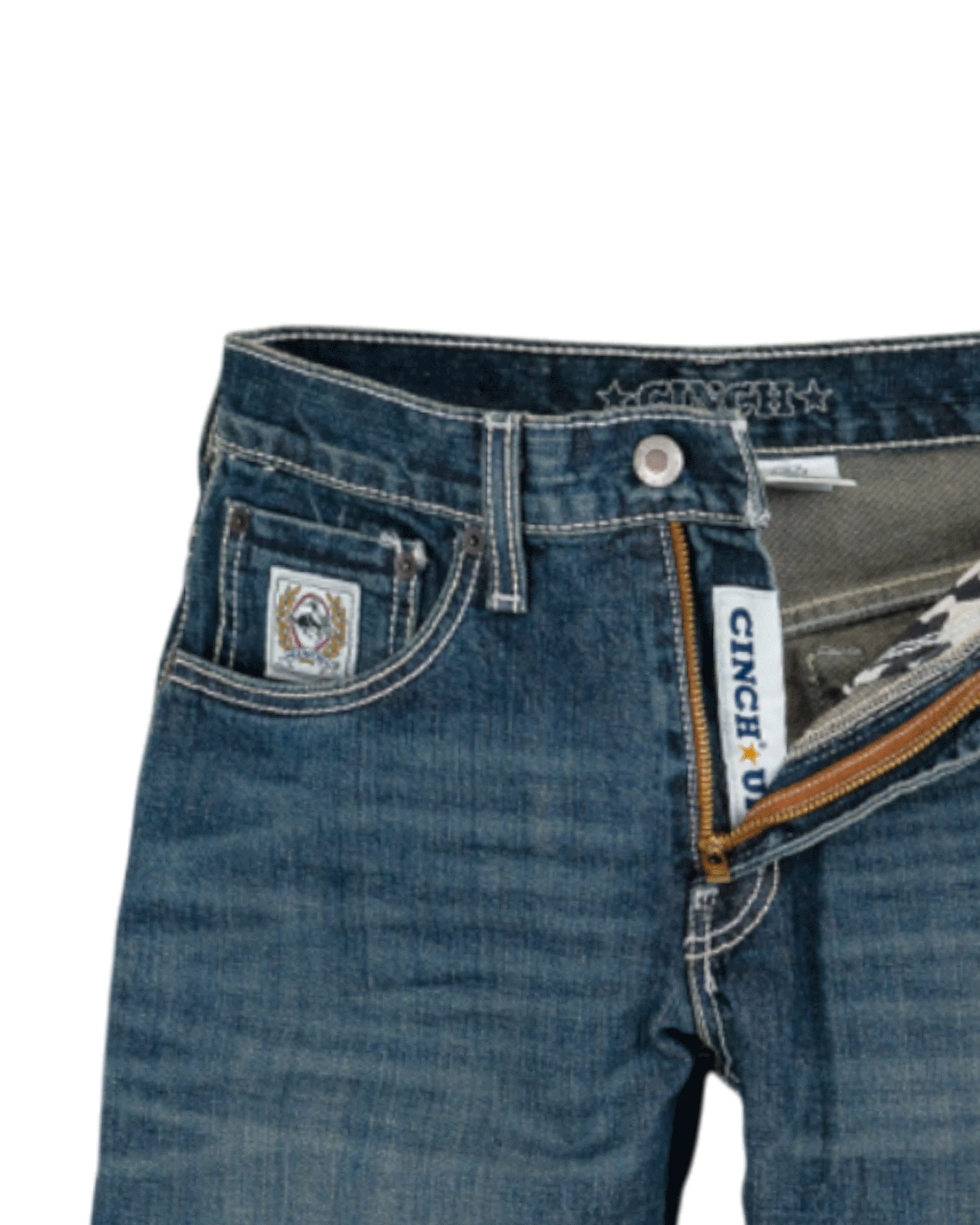 Close-up of blue jeans with Cinch branding on a white background