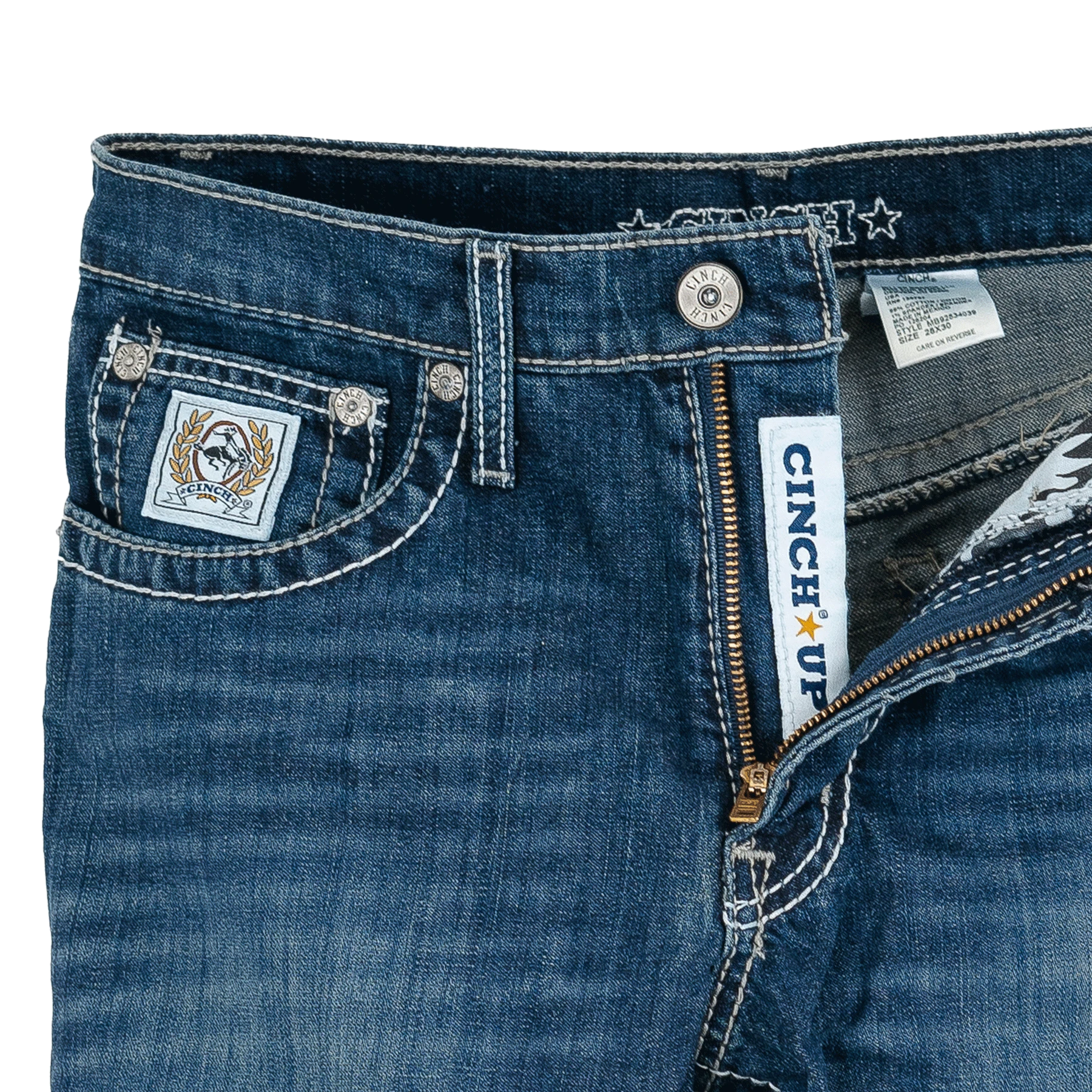 Close-up of blue jeans with brand labels and details.