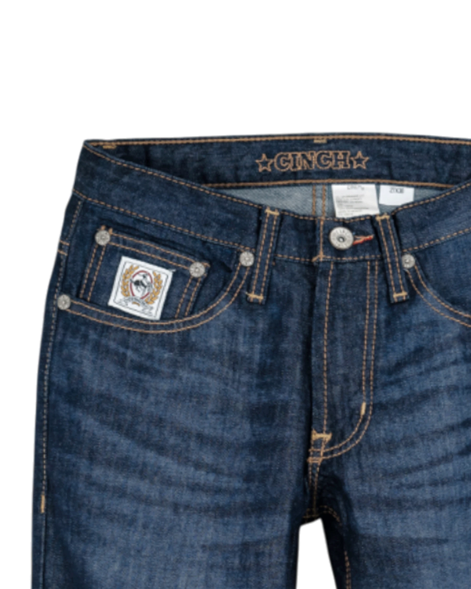 Close-up of blue jeans with visible branding on a white background