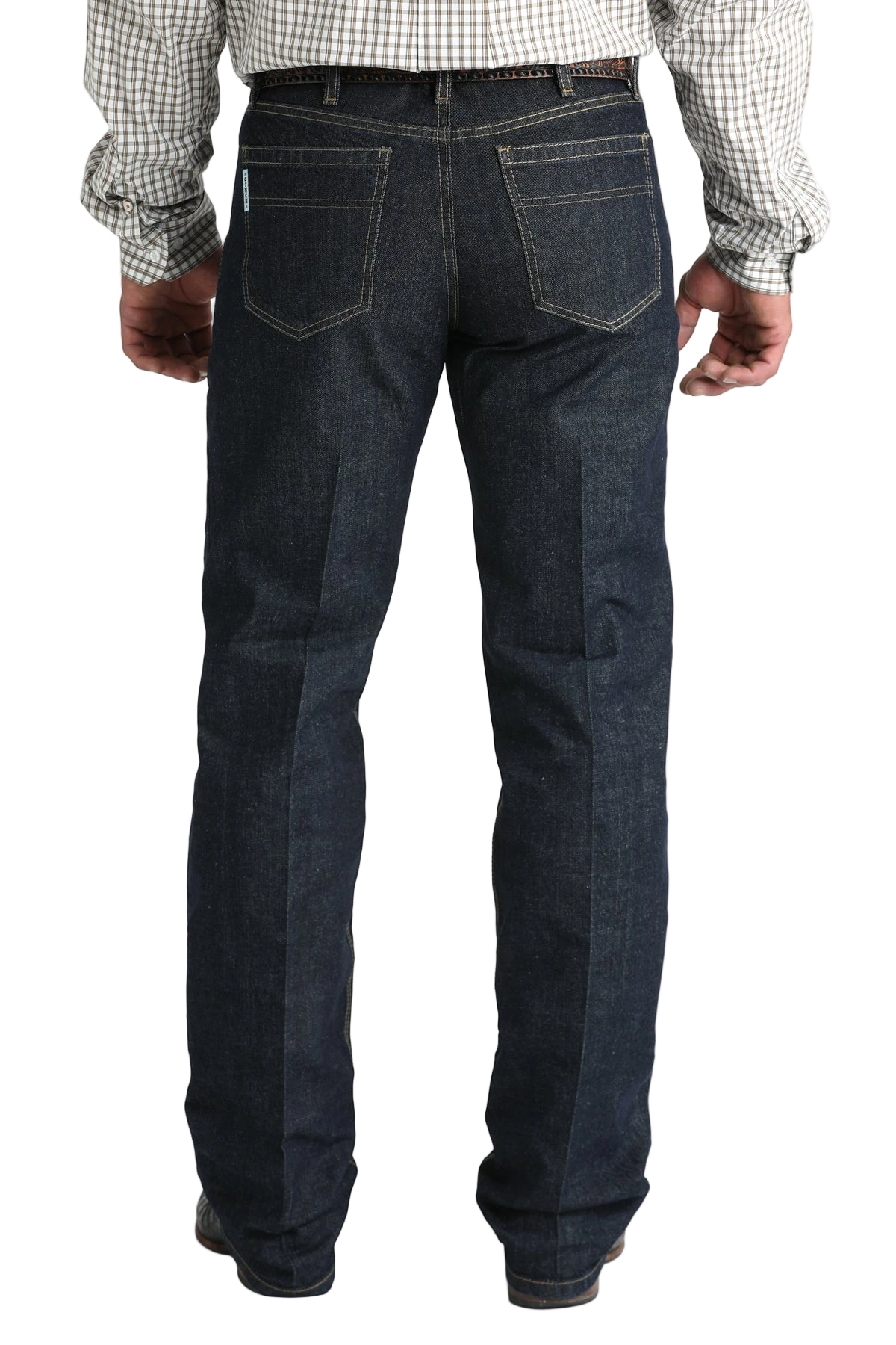 Back view of a man wearing dark blue denim jeans, and a belt, with a tucked-in patterned shirt