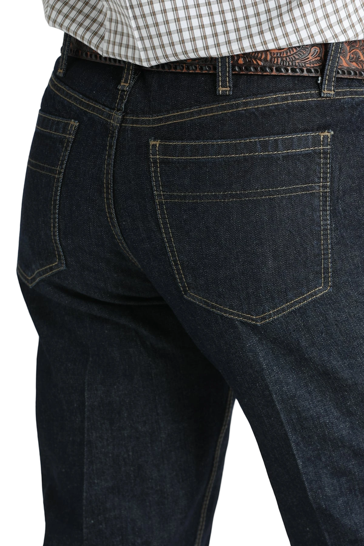 Close-up, back view of a man wearing dark blue denim jeans, and a belt, with a tucked-in patterned shirt