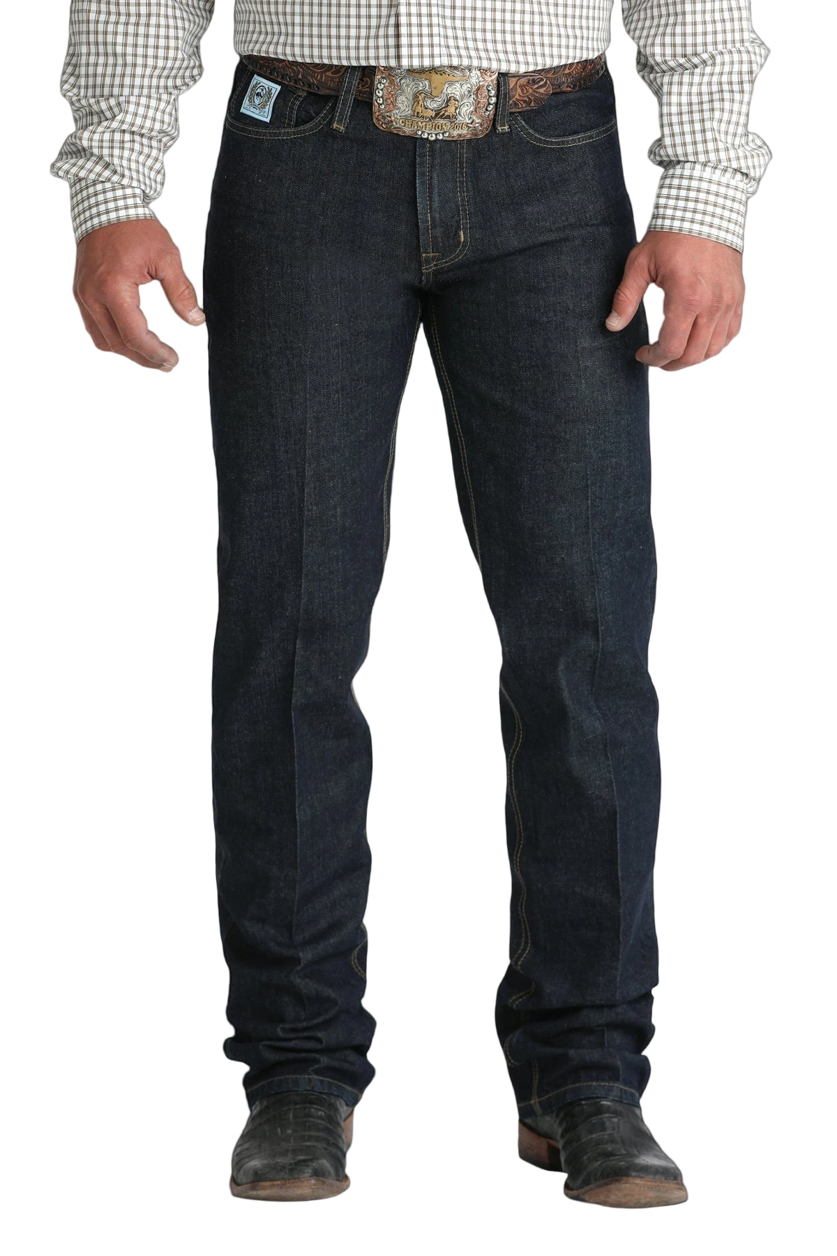 Front view of a man wearing dark blue denim jeans, and a belt, with a tucked-in patterned shirt and boots