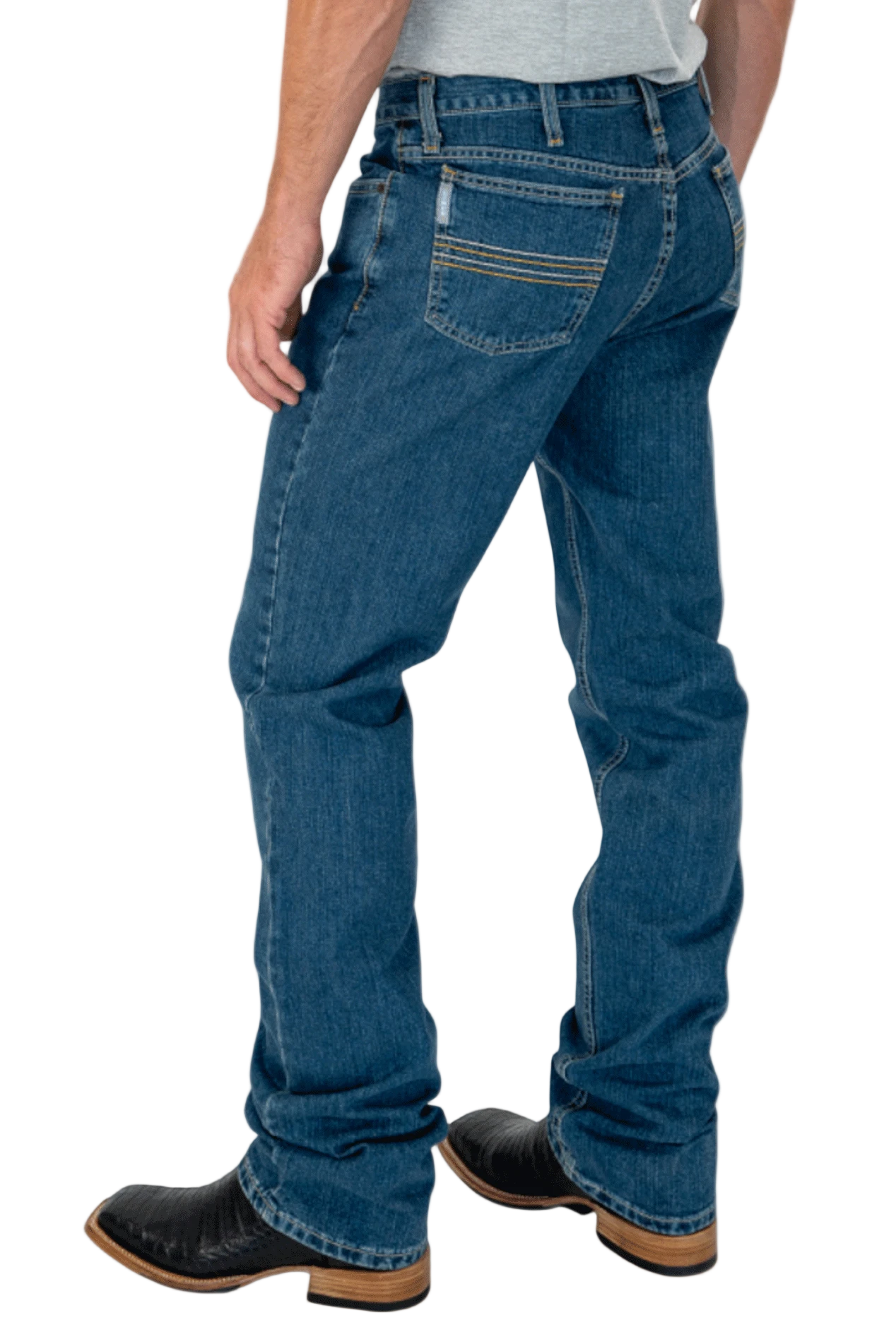 Person wearing blue jeans and black boots on a white background