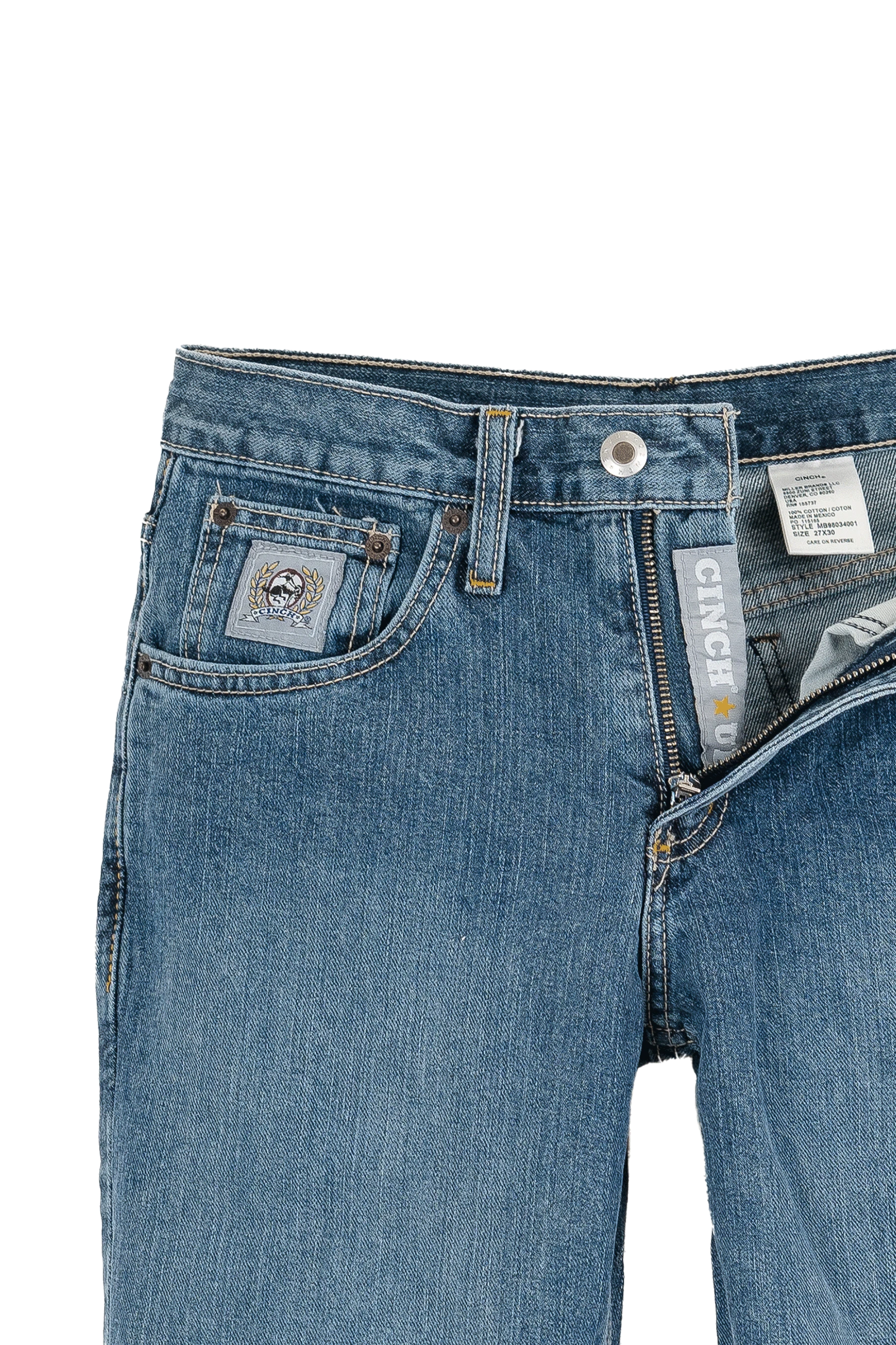 Close-up of blue jeans with Carhartt branding on a white background