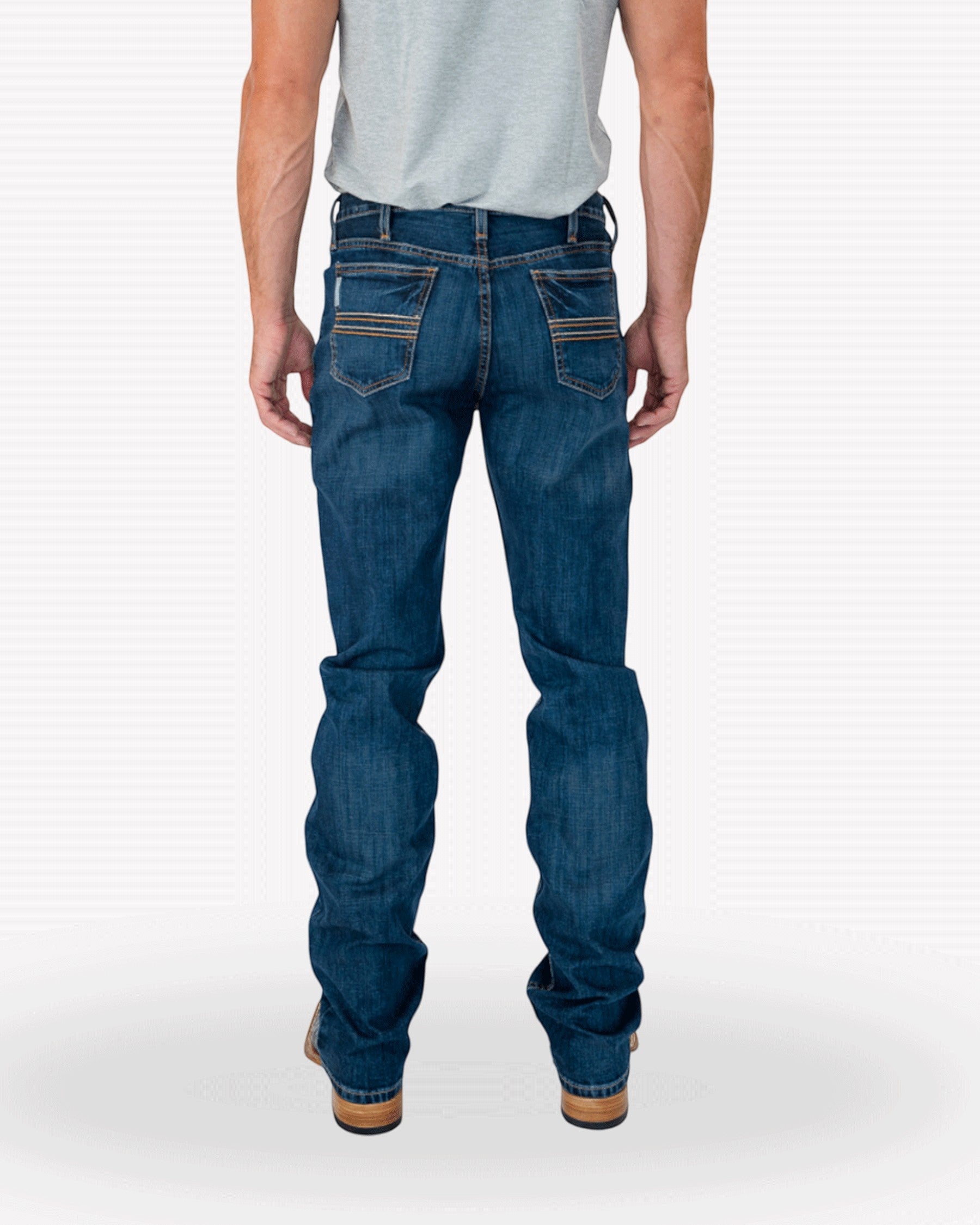 Back view of a man wearing blue denim jeans with a tucked-in t-shirt