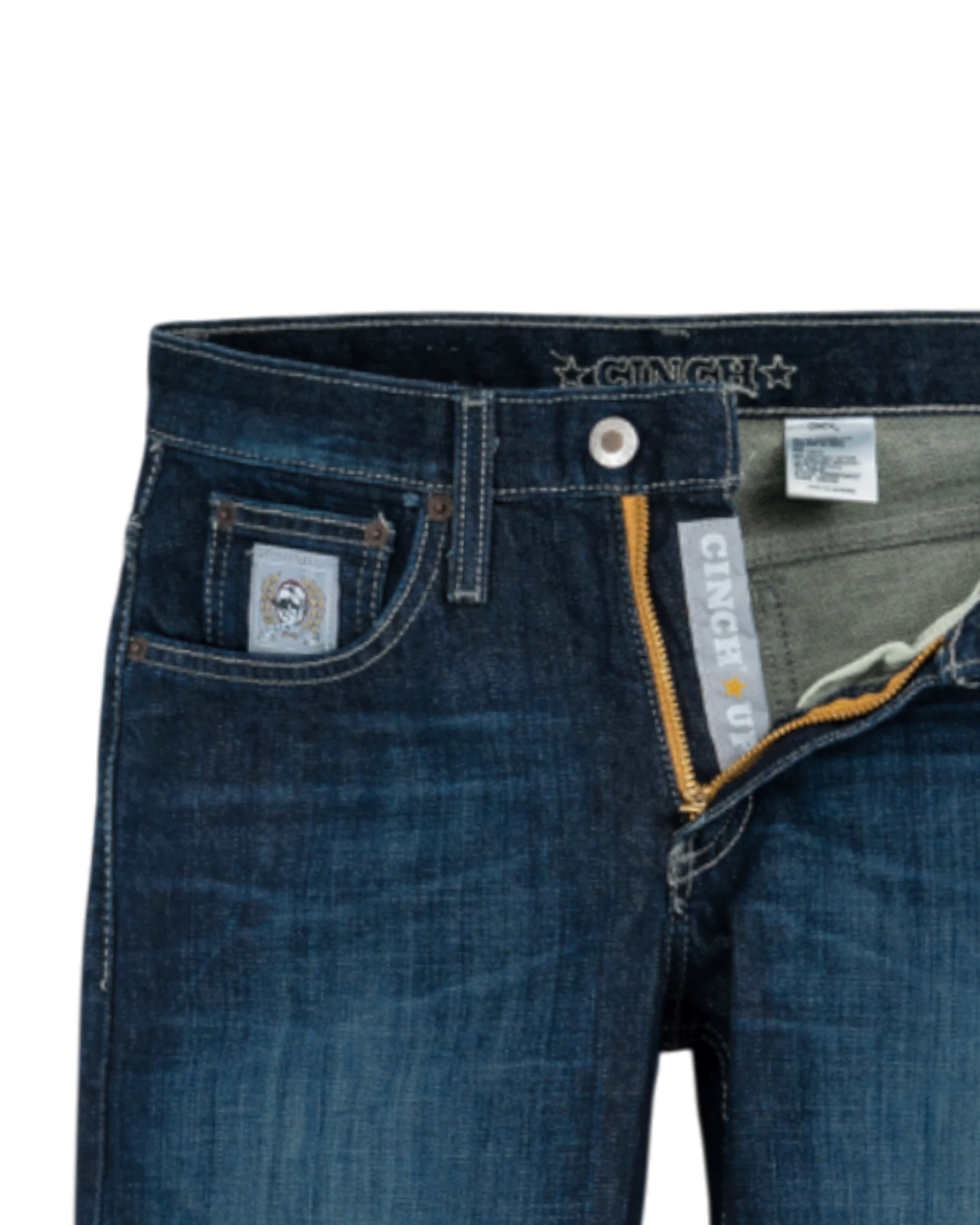 Close-up of blue jeans with brand labels on a white background