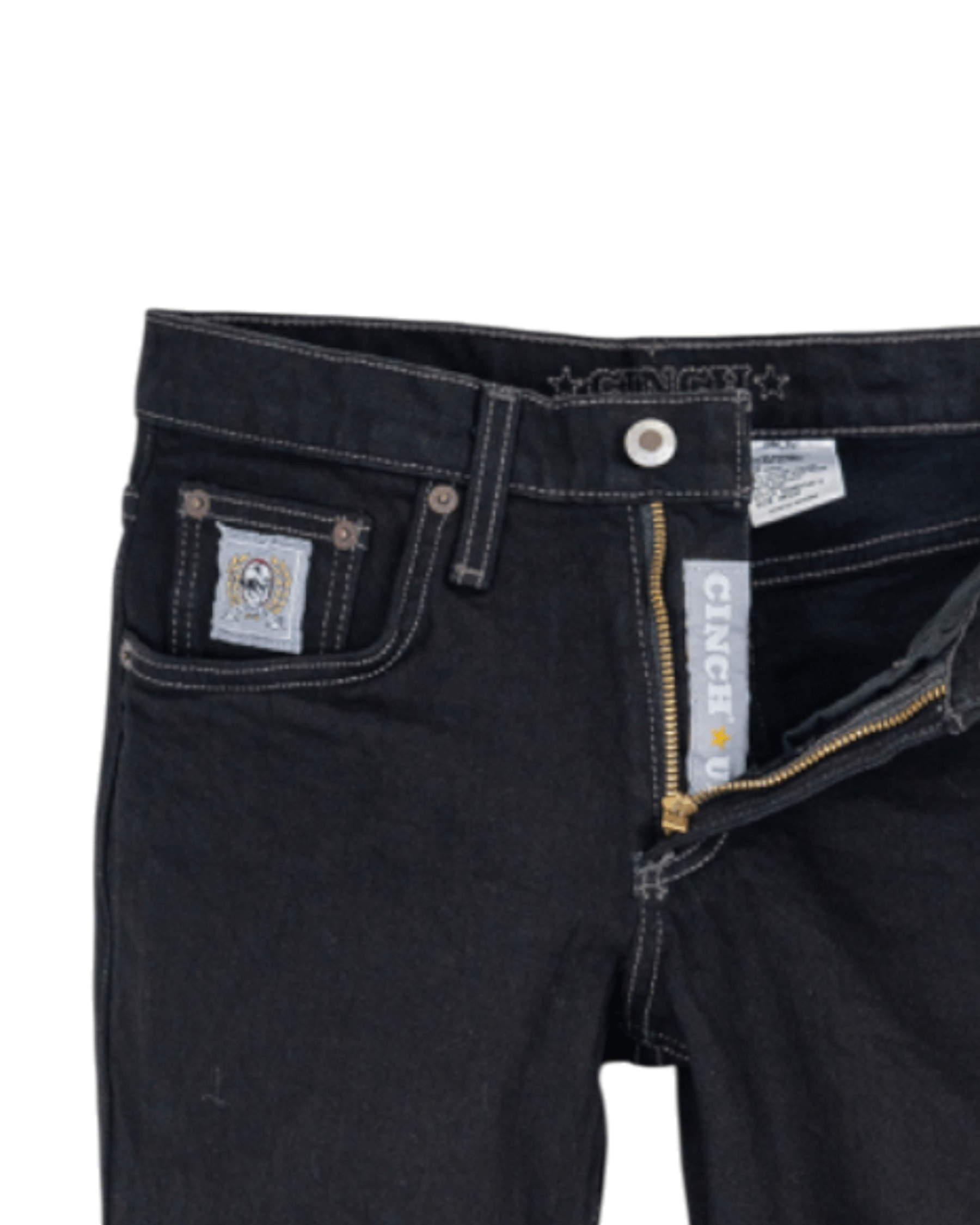 Close-up of black jeans with a brand label on a white background