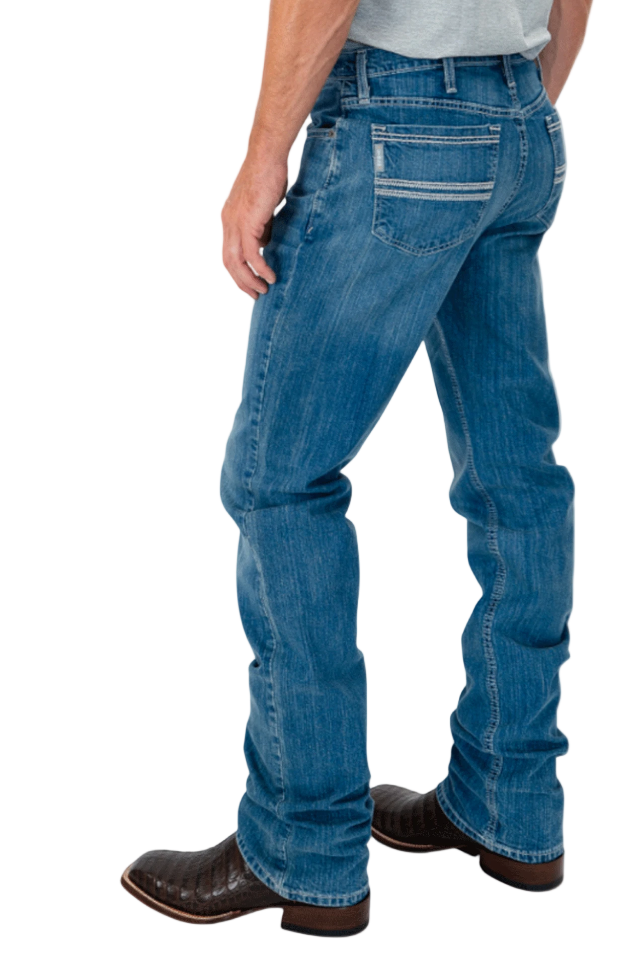 Person wearing blue jeans and brown boots on a white background