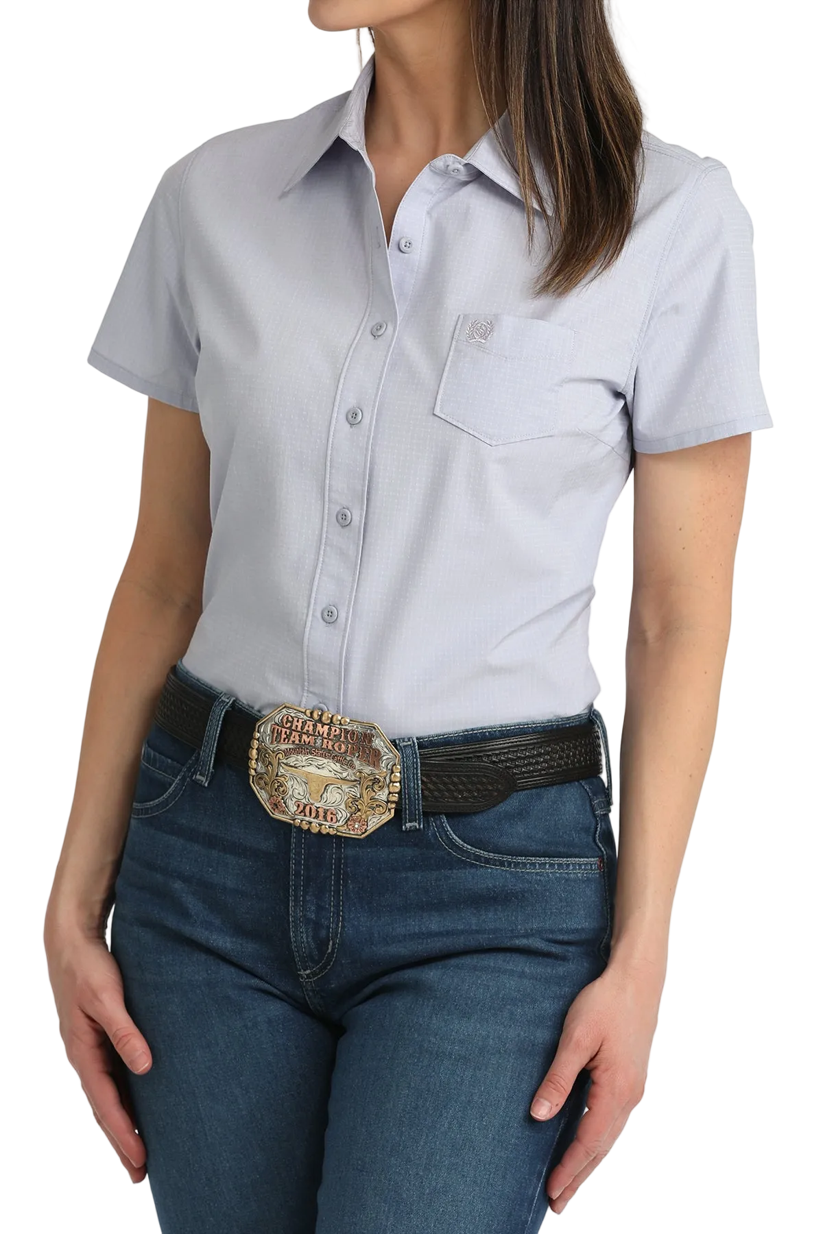 Woman wearing a light blue shirt and jeans with a belt and buckle on a white background