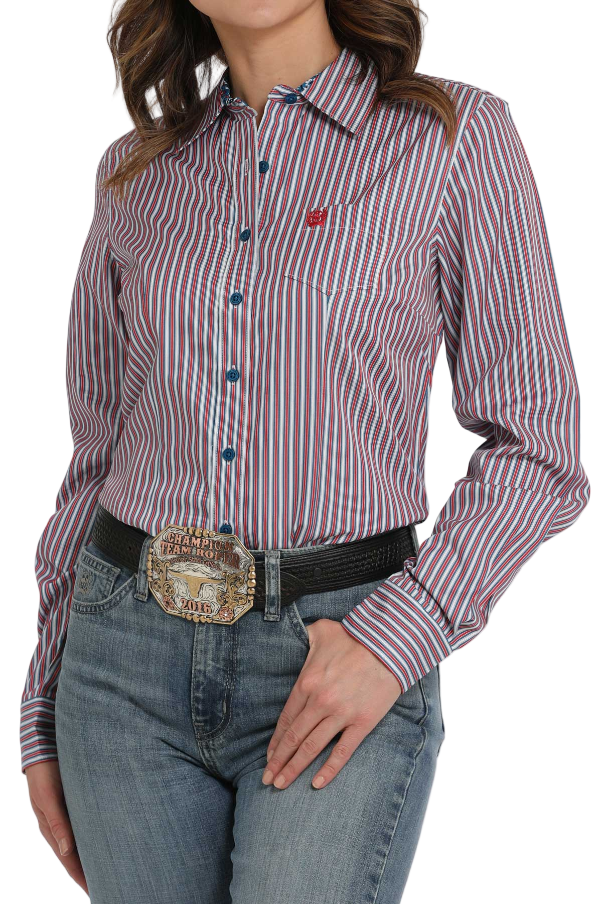 Woman wearing a purple striped long-sleeve button-down shirt, paired with jeans and a large western belt buckle