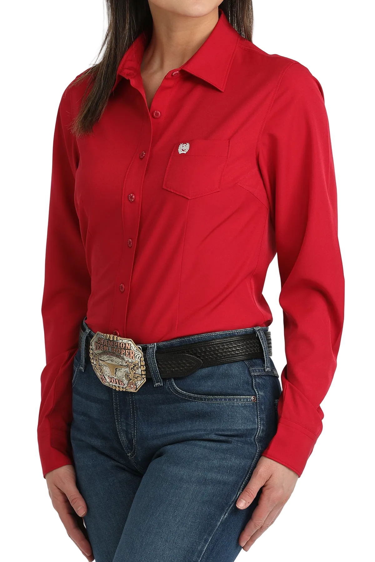Person wearing a red shirt and blue jeans with a belt buckle.