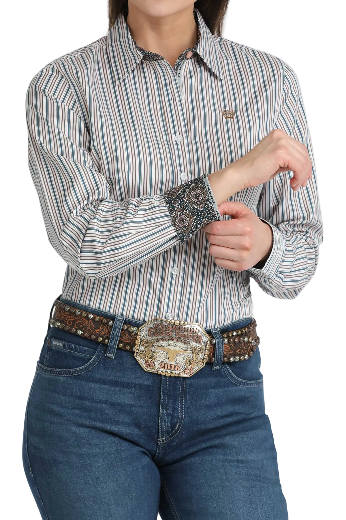 Person wearing a striped shirt with long sleeves and jeans on a white background
