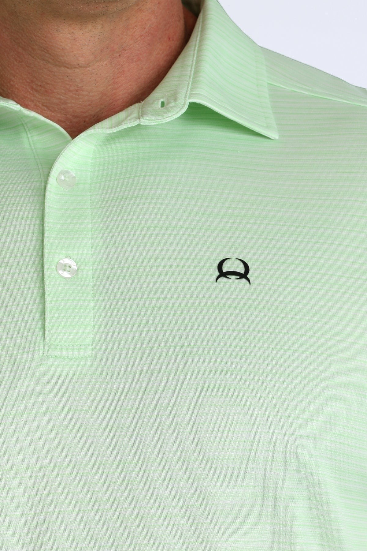 Go West Supply green short sleeve polo shirt with subtle stripe texture and CINCH logo.