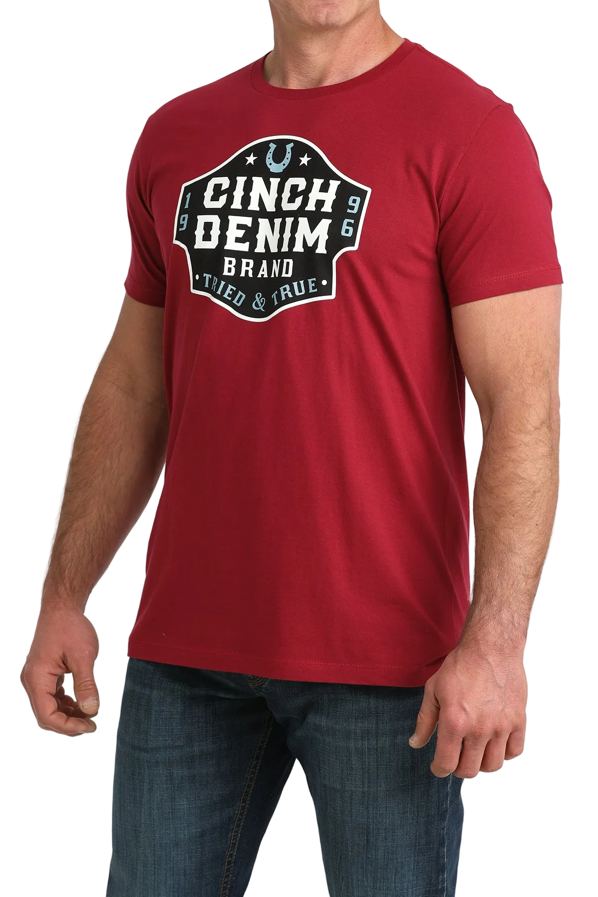 Red t-shirt with Cinch Denim Brand logo worn by a person on a white background
