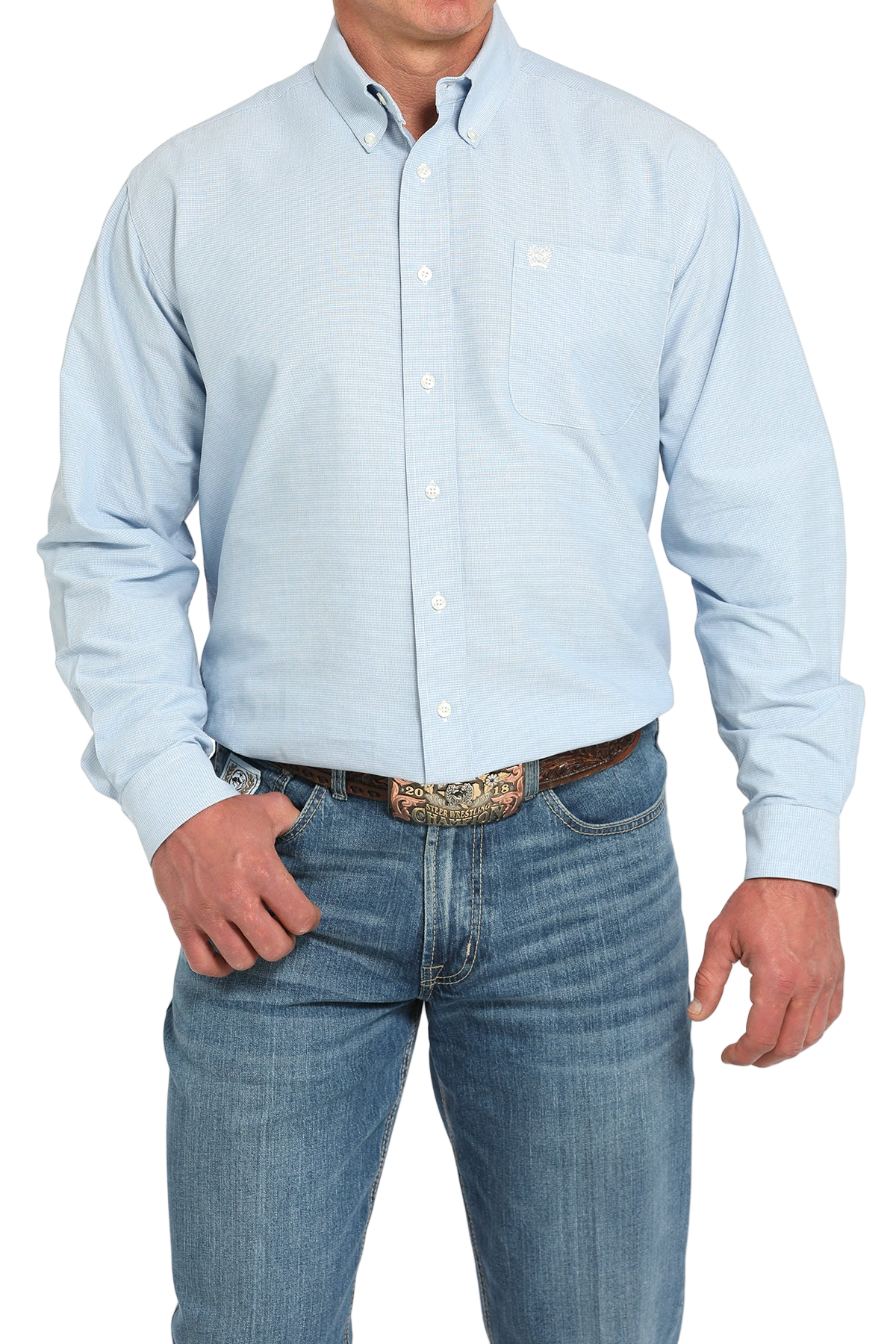 Man wearing a light blue button-up shirt with blue jeans on a white background