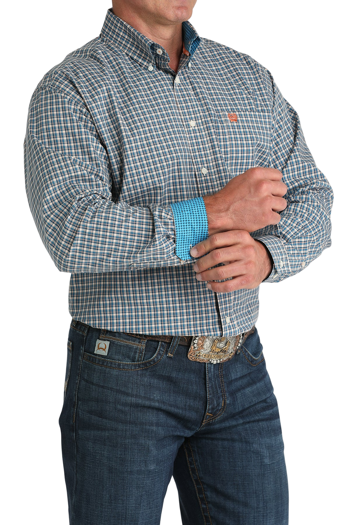 Man wearing a patterned blue long sleeve button-down shirt with contrasting cuffs and jeans on a transparent background 