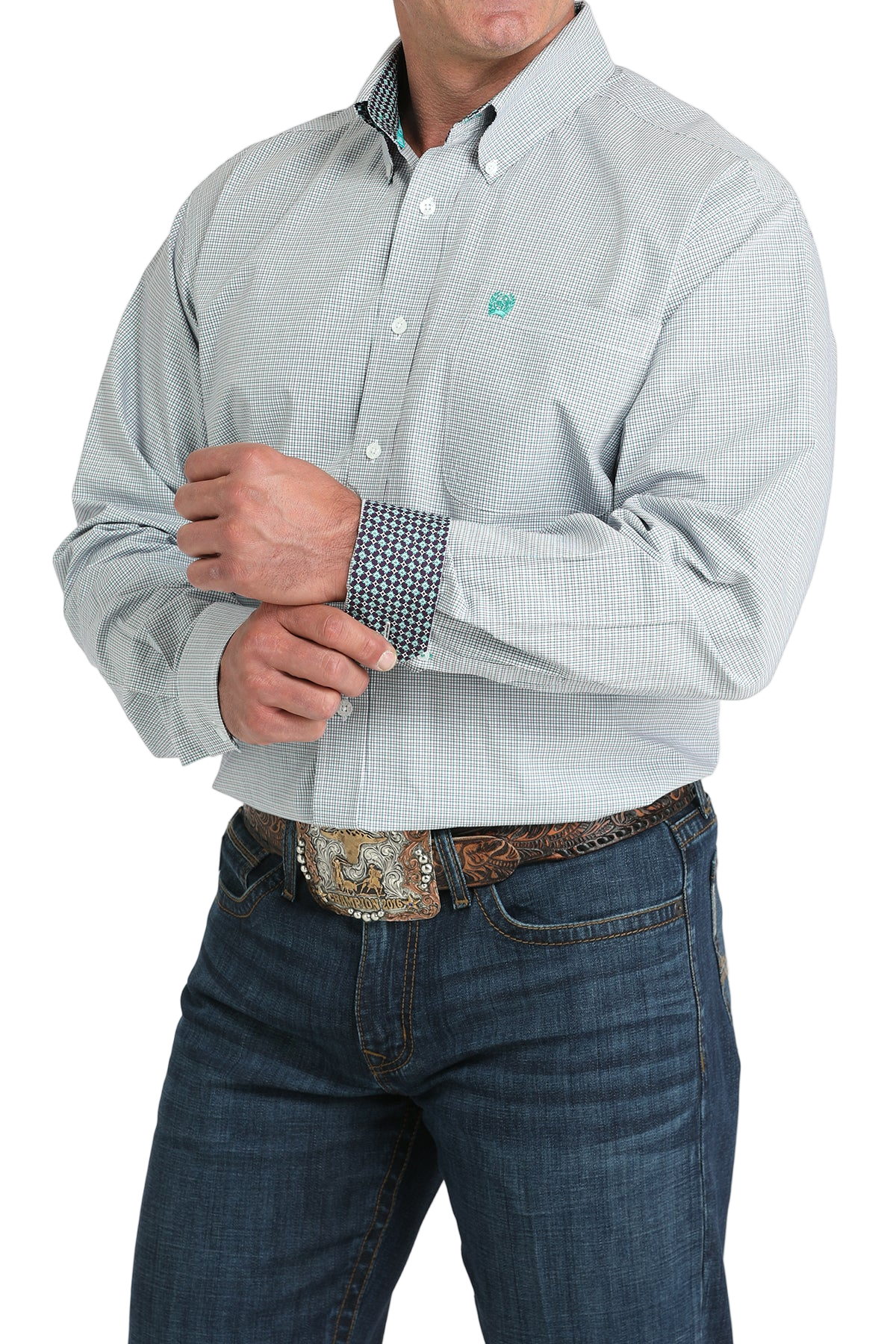Man wearing a patterned light blue long sleeve button-down shirt with contrasting cuffs and jeans on a transparent background 