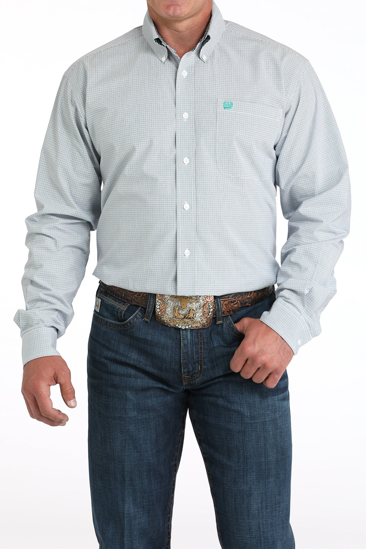 Man wearing a white plaid long sleeve button-down shirt with jeans and a belt 