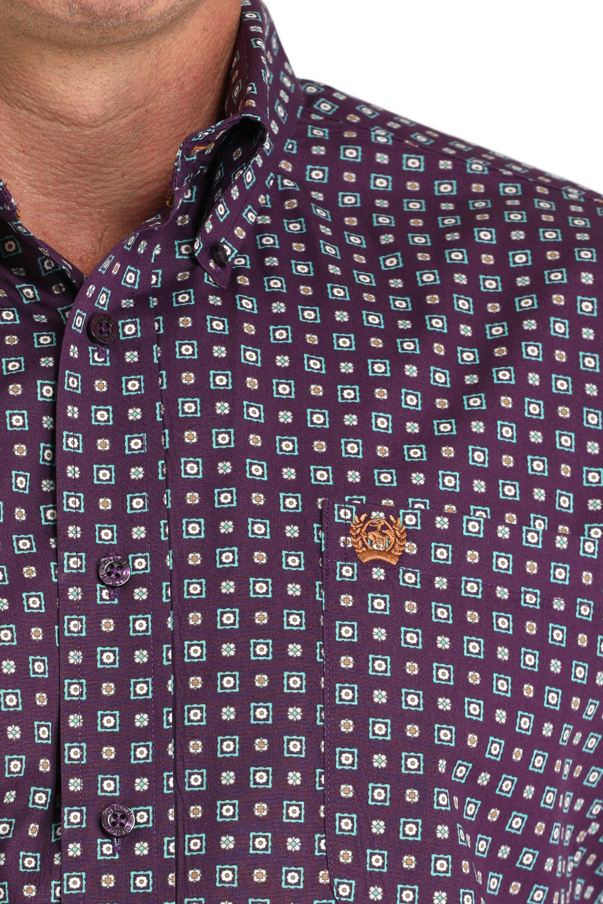 Close-up of a man wearing a patterned purple long sleeve button-down shirt on a transparent background 