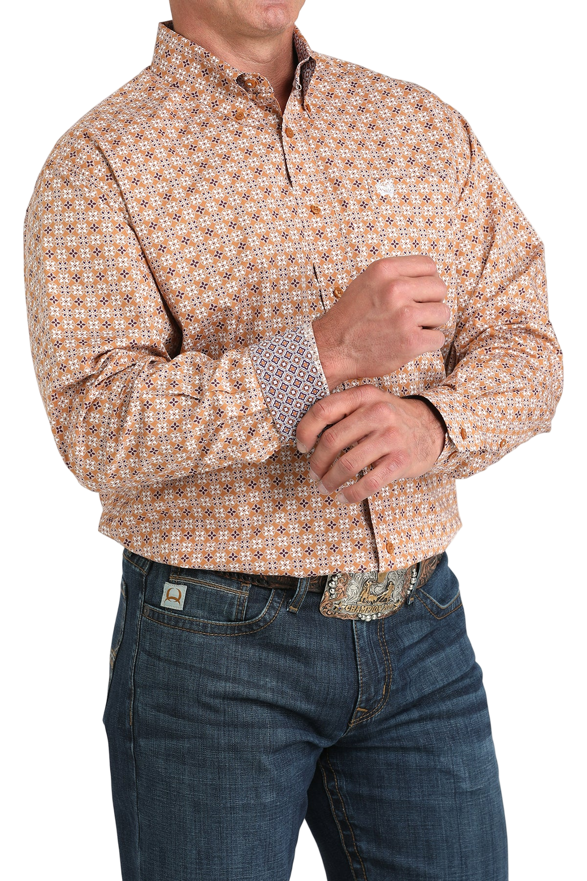 Man wearing a patterned orange long sleeve button-down shirt with contrasting cuffs and jeans on a transparent background 