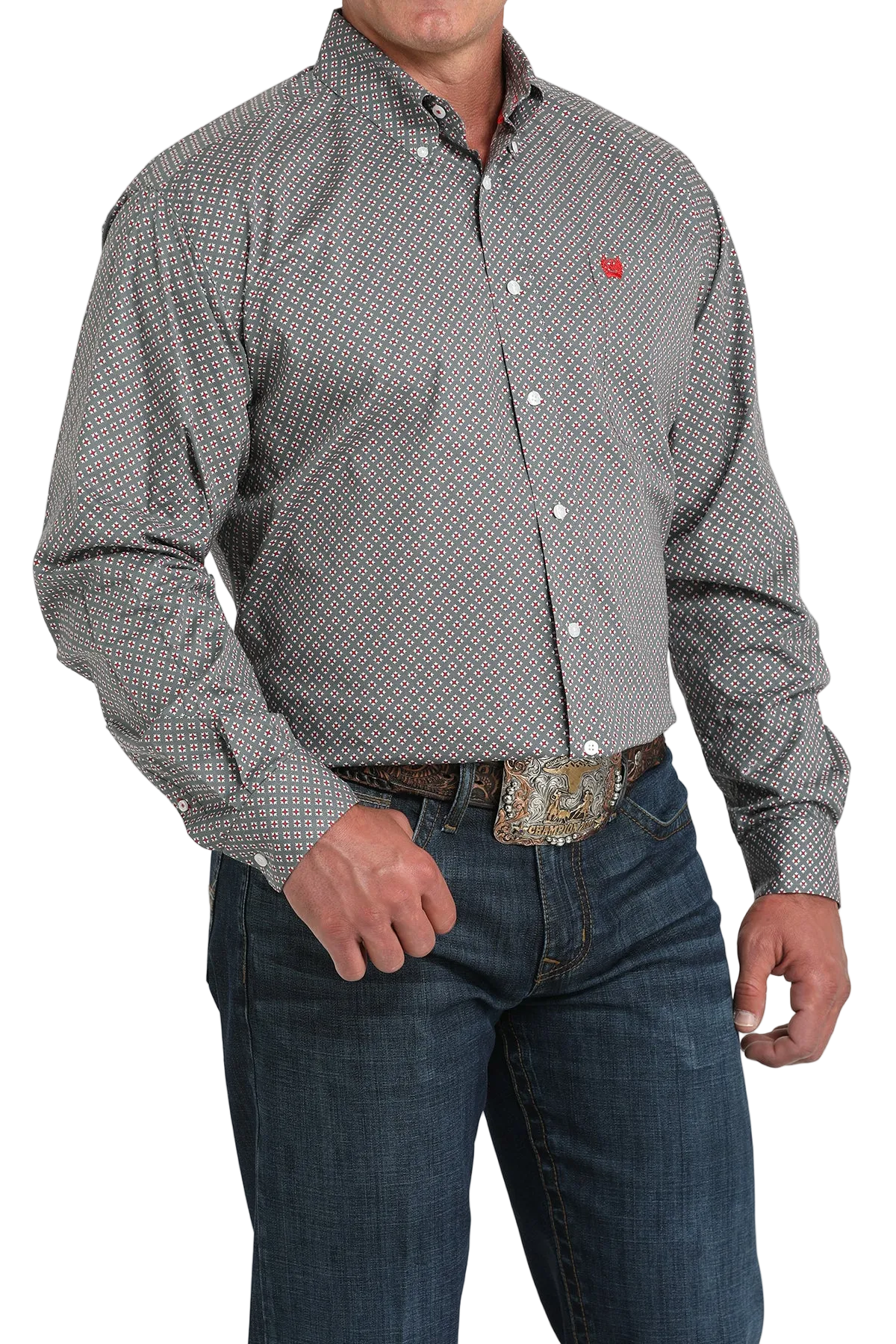 A man wearing a gray patterned button-up shirt, dark jeans, and a large belt buckle stands against a transparent background