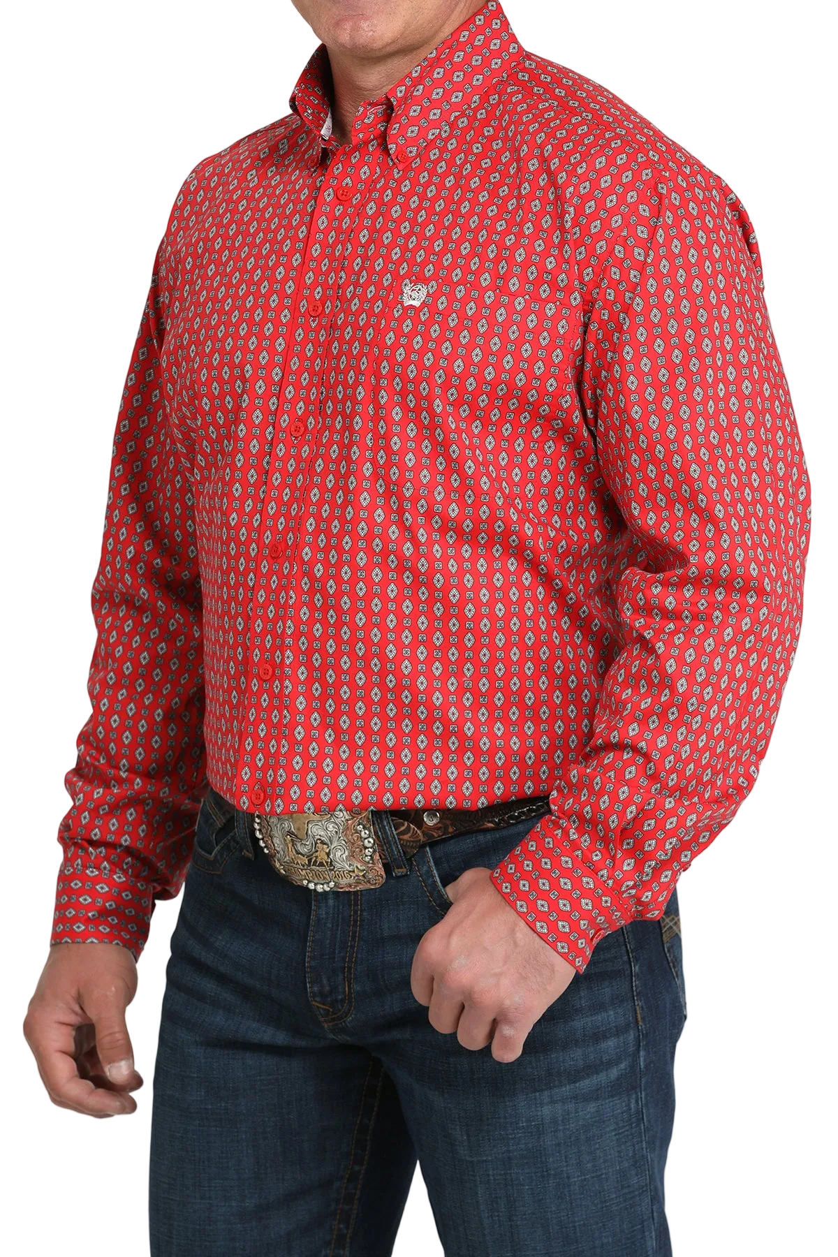 A man wearing a red patterned button-up shirt, dark jeans, and a large belt buckle, standing against a transparent background