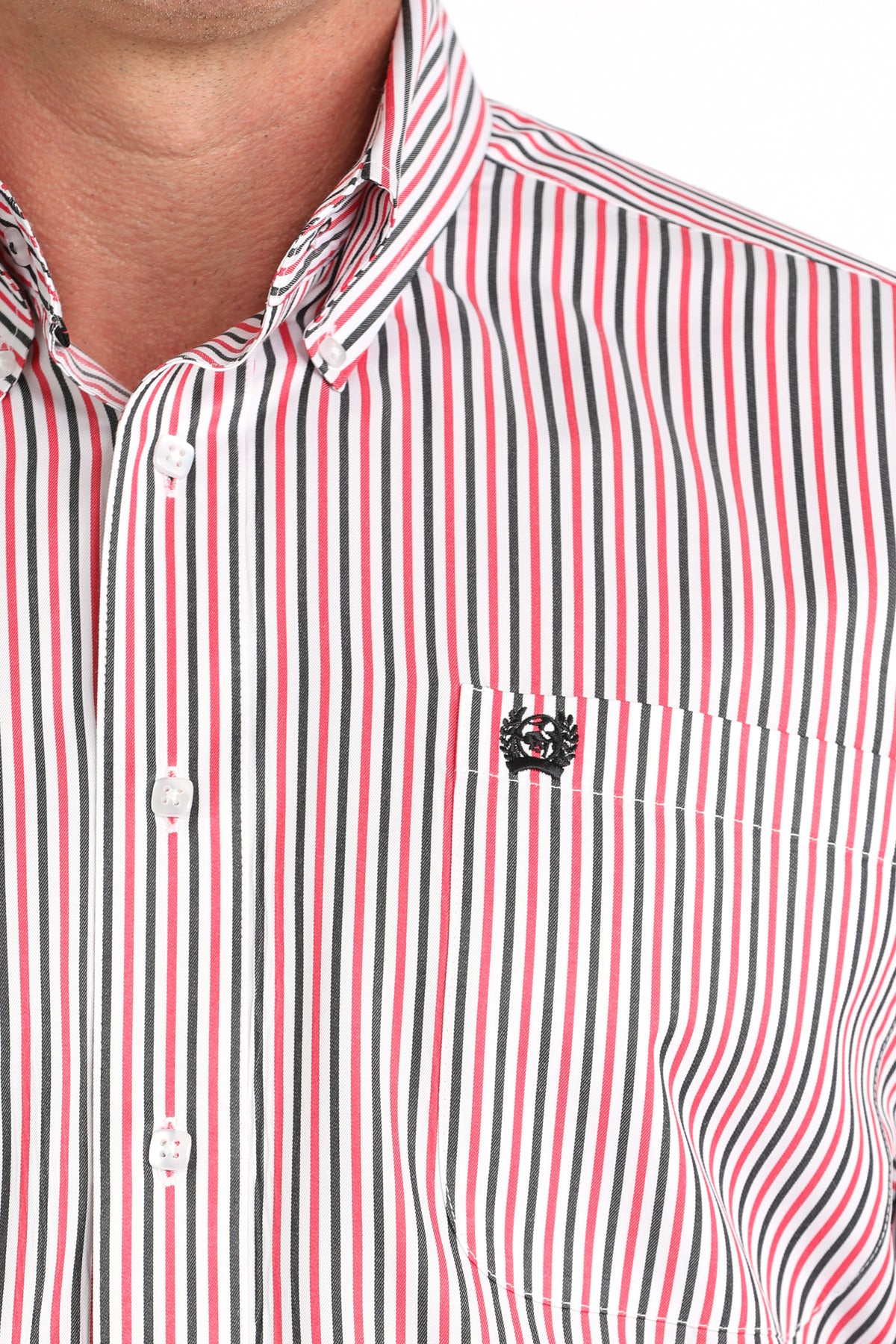 Close-up of a red, white, and black striped shirt with a brand logo on the chest.