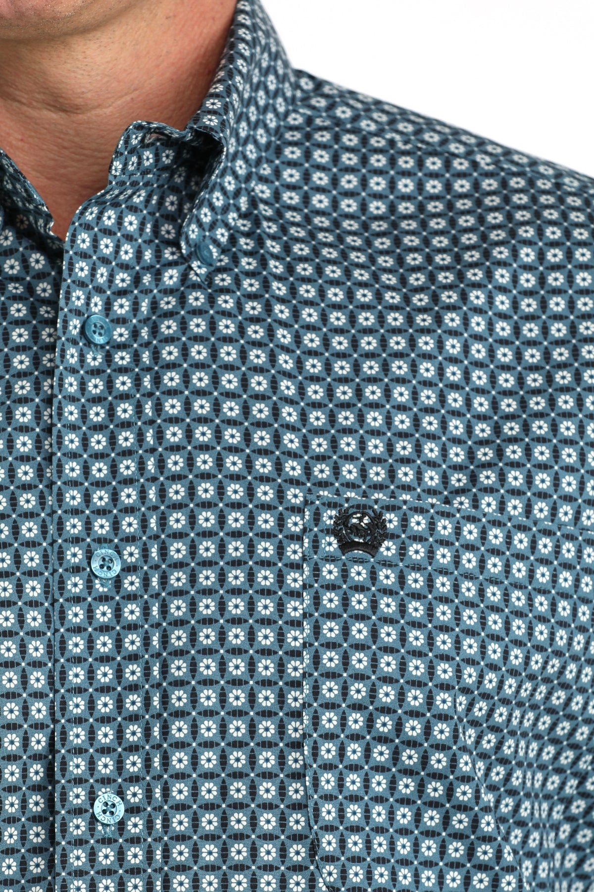 Close-up of a patterned shirt with small geometric design