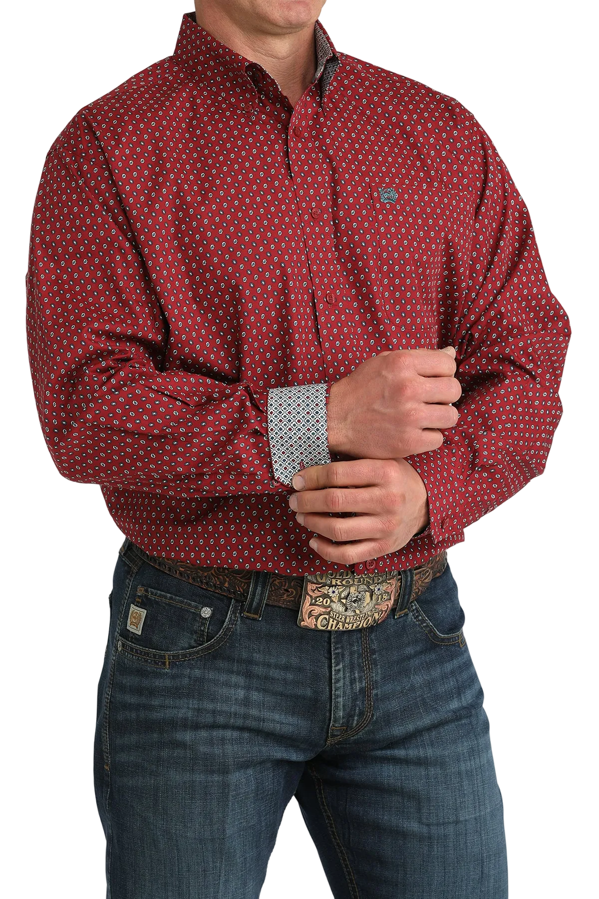 Man wearing a red patterned shirt and blue jeans on a white background
