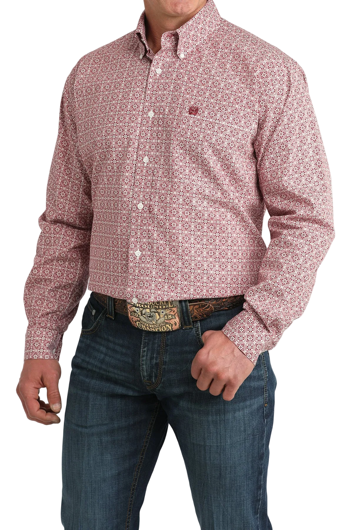 Man wearing a patterned red shirt and jeans on a white background