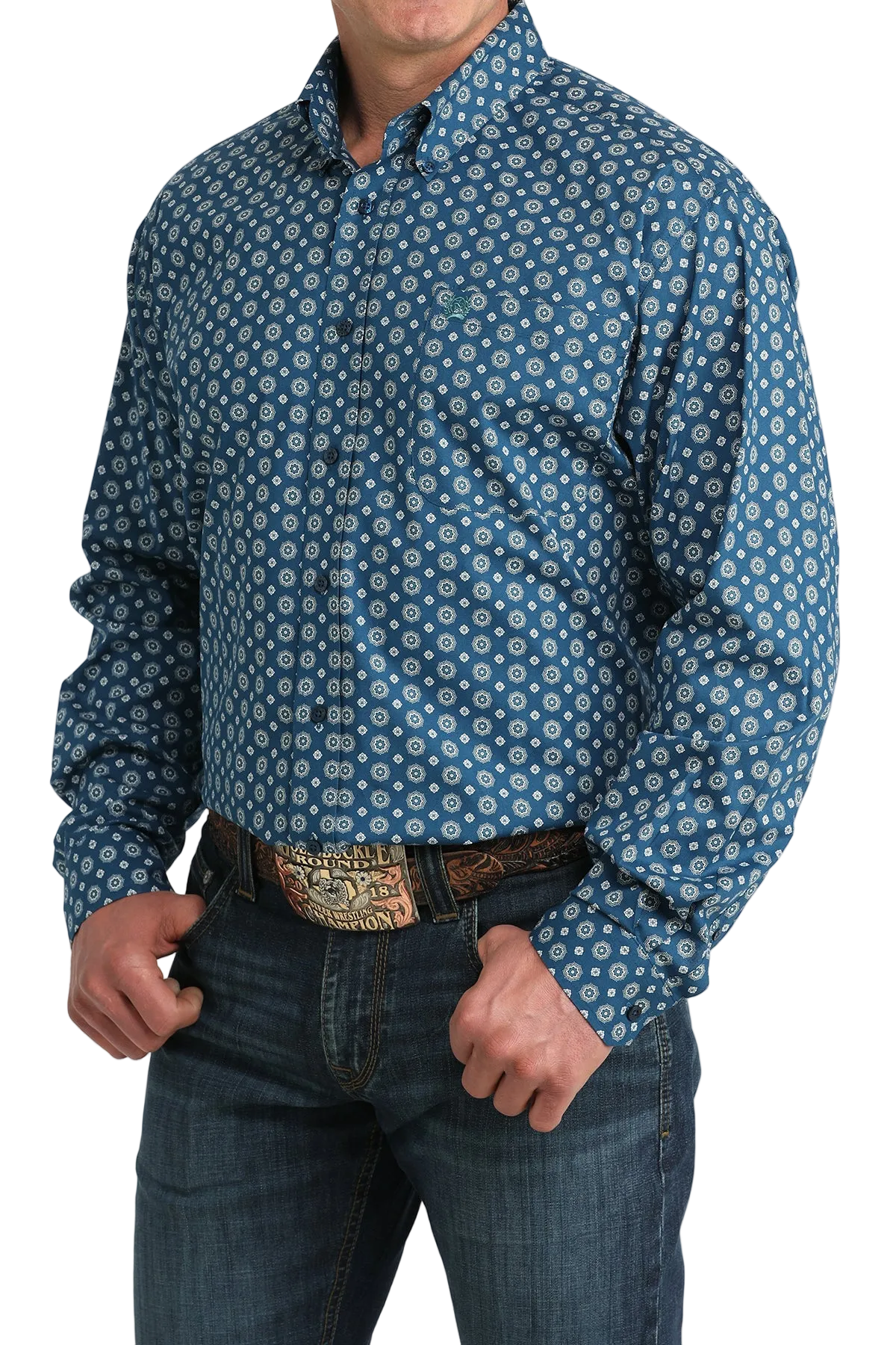 Man wearing a blue patterned shirt and jeans on a white background