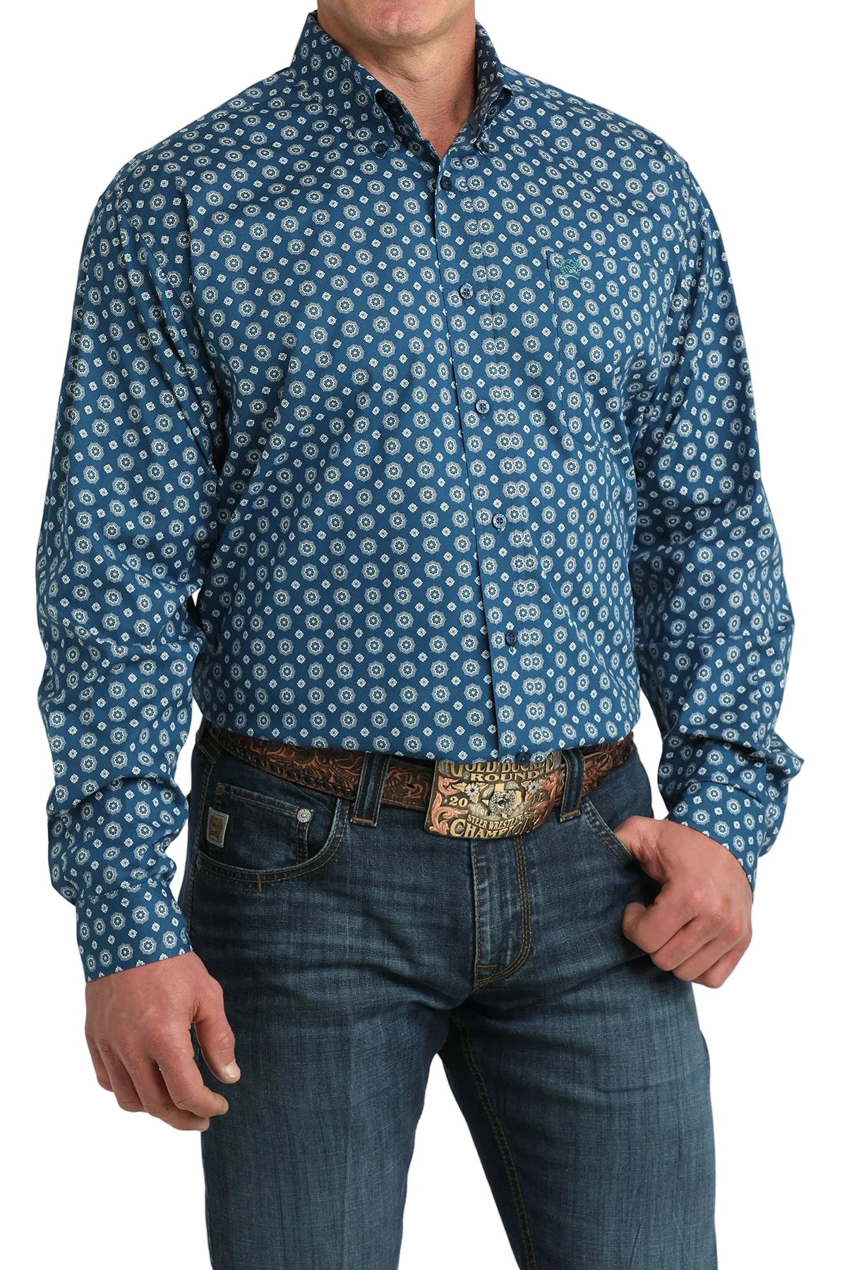 Man wearing a blue patterned shirt and jeans on a white background