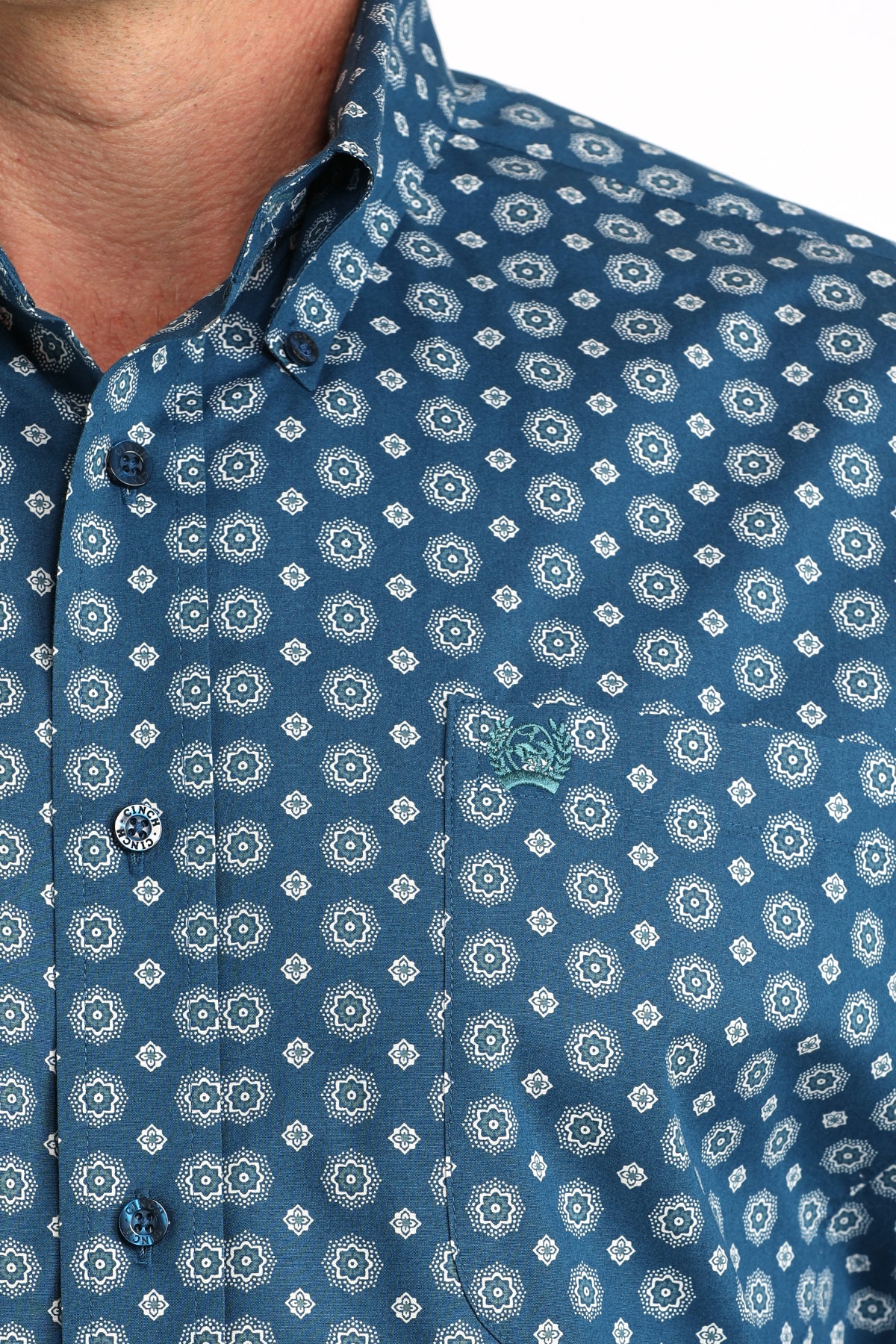 Close-up of a blue patterned shirt with a collar
