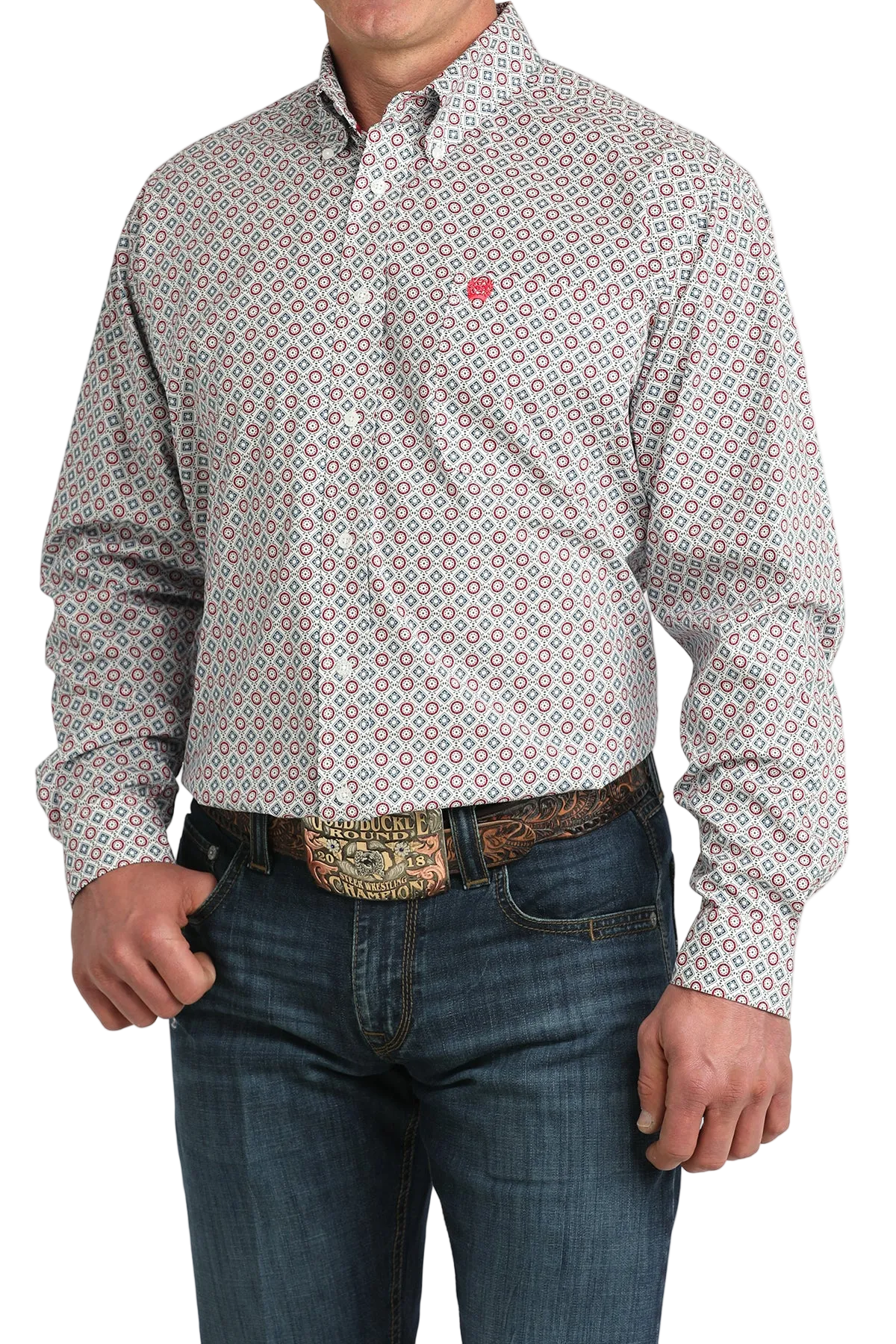 Man wearing a patterned shirt and jeans on a white background