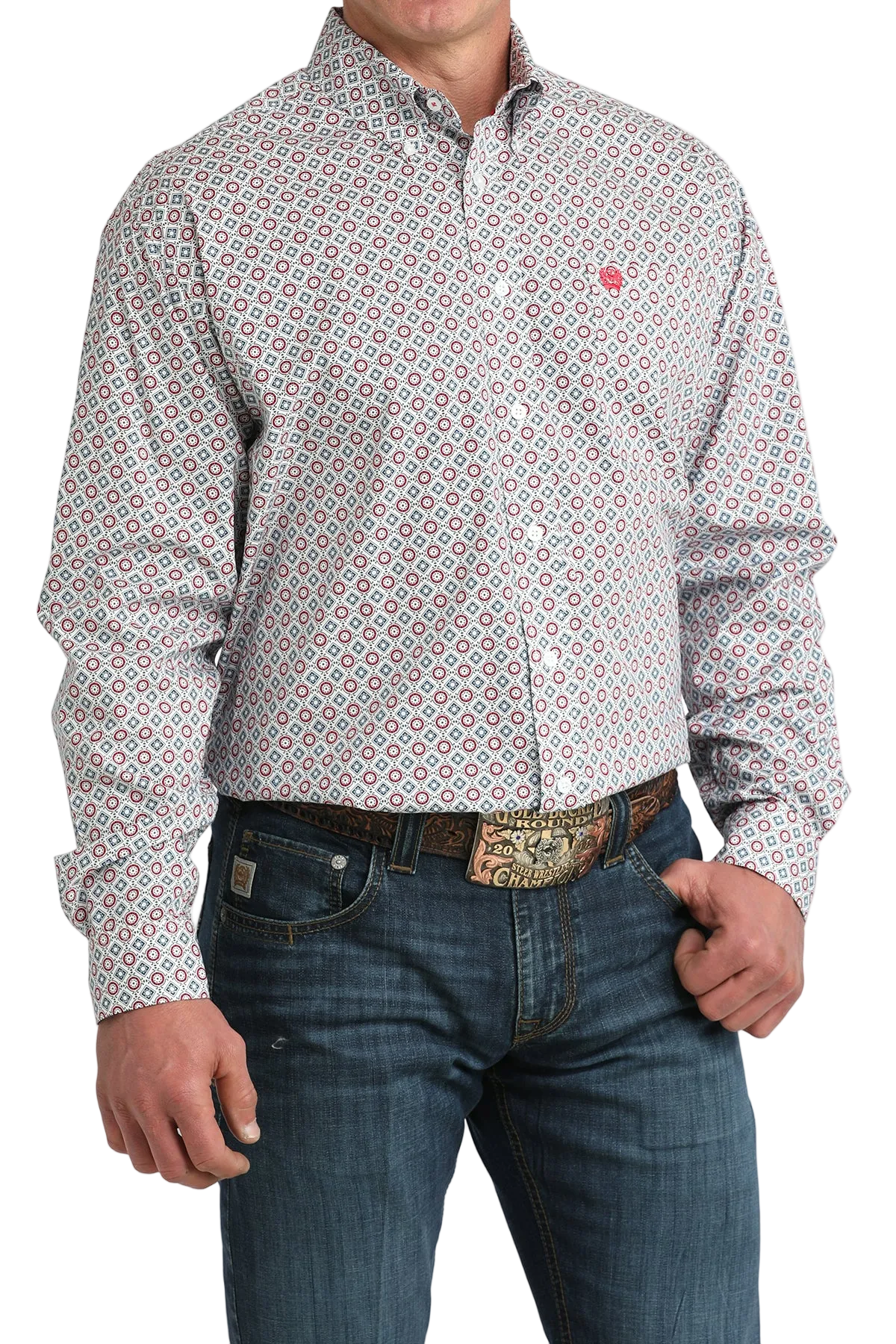 Man wearing a patterned shirt and jeans on a white background