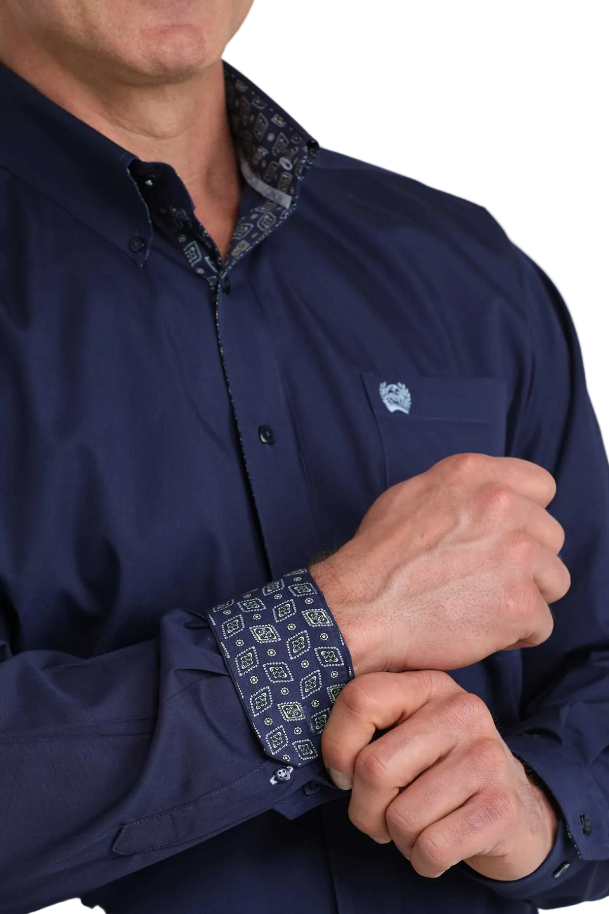 Navy blue shirt with patterned cuffs and collar on a white background