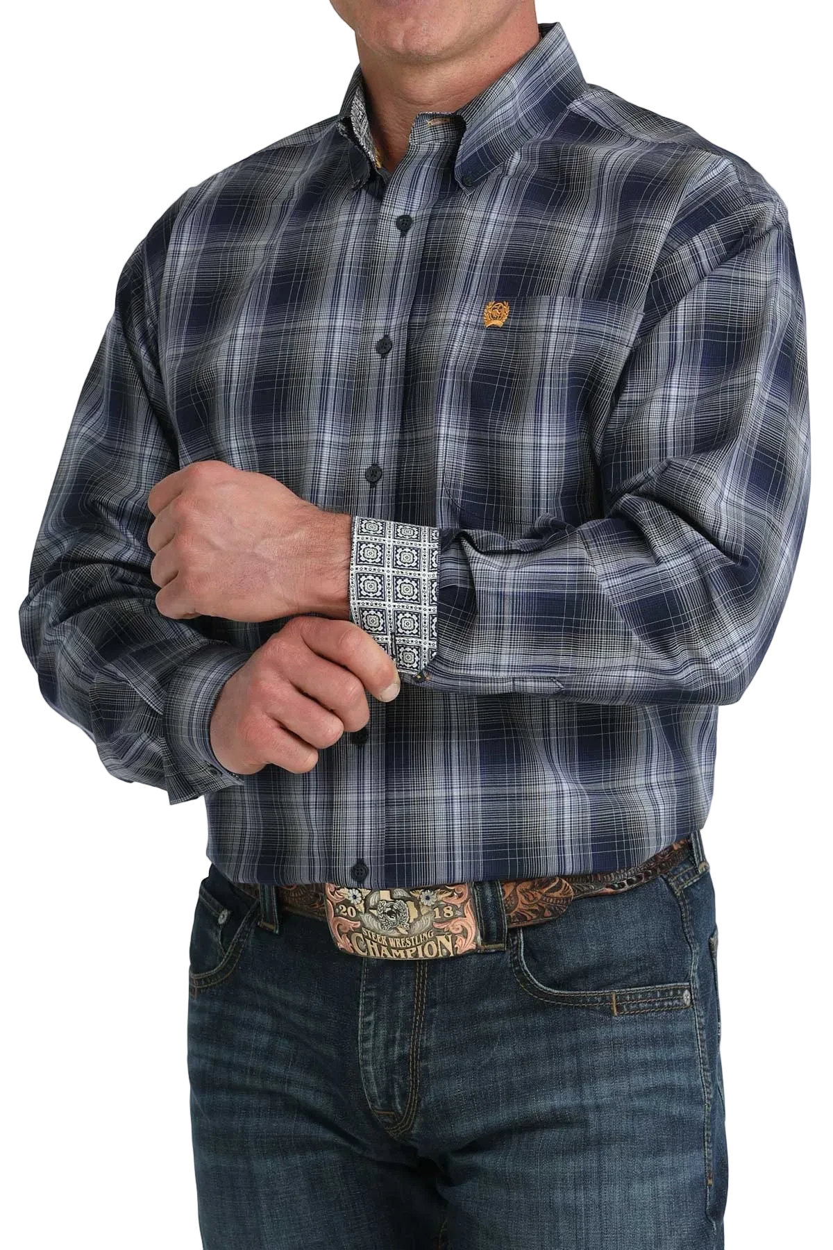Man wearing a plaid shirt with a visible brand logo on a white background