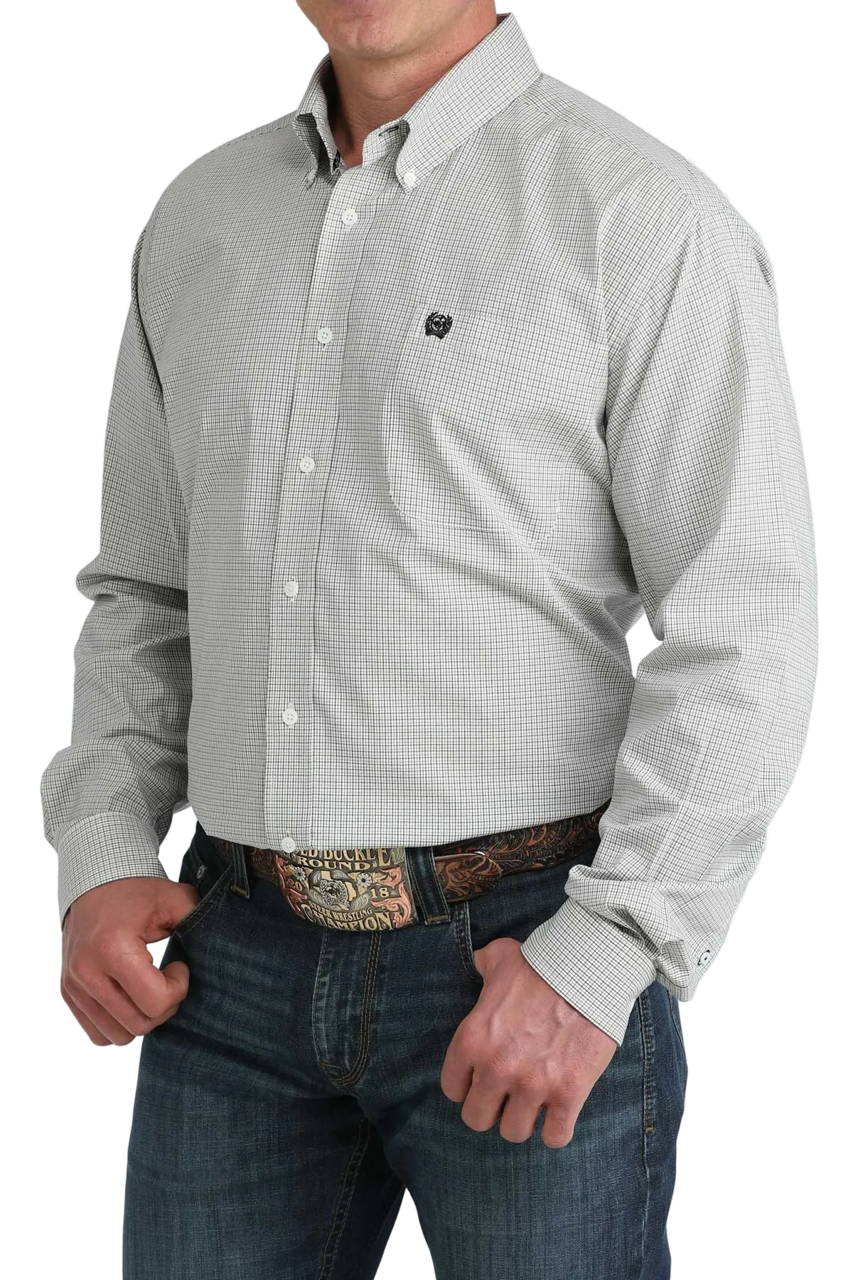 Man wearing a patterned shirt with a visible brand logo on a white background