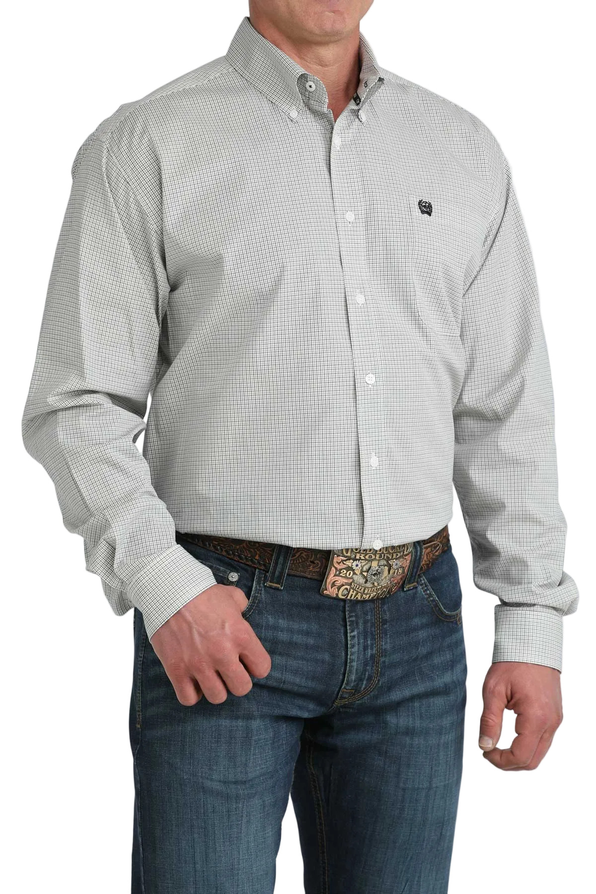 Man wearing a light gray patterned button-up shirt and blue jeans on a white background