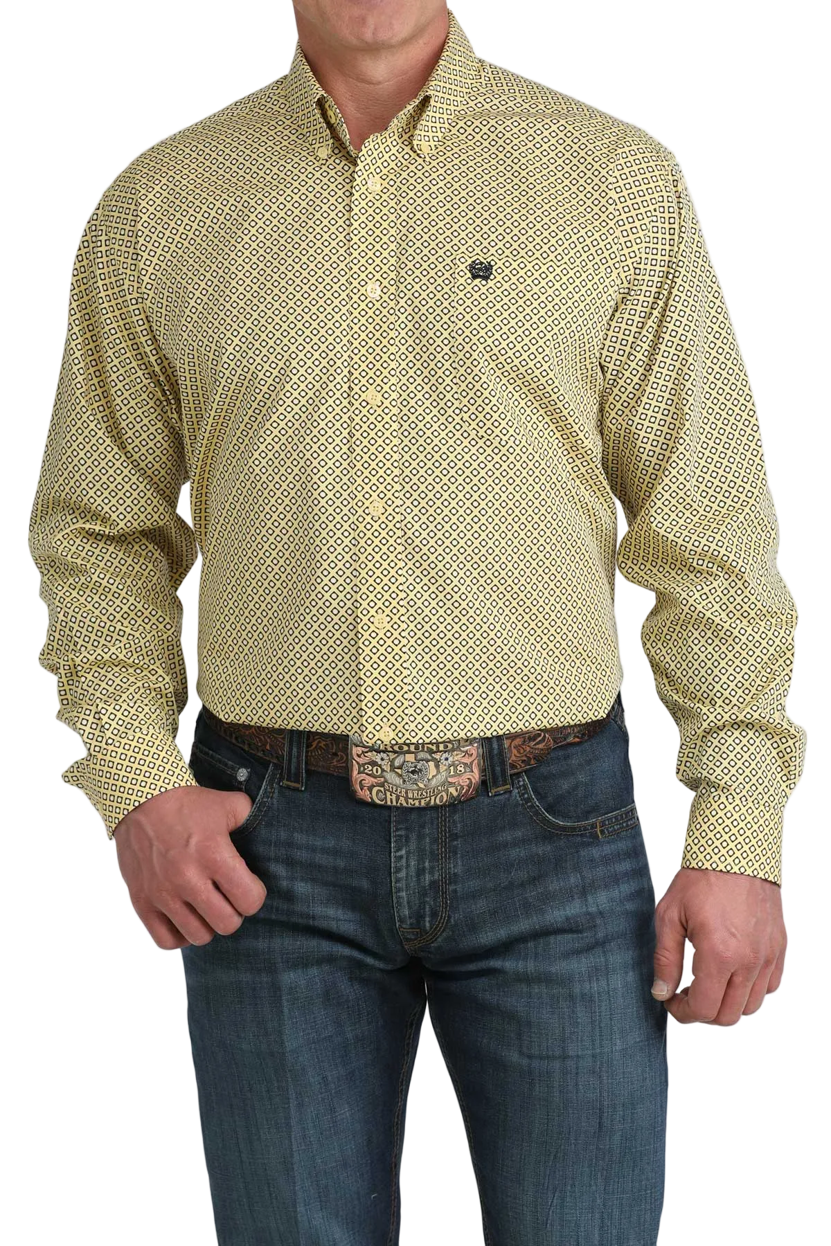 Man wearing a patterned yellow shirt and jeans on a white background