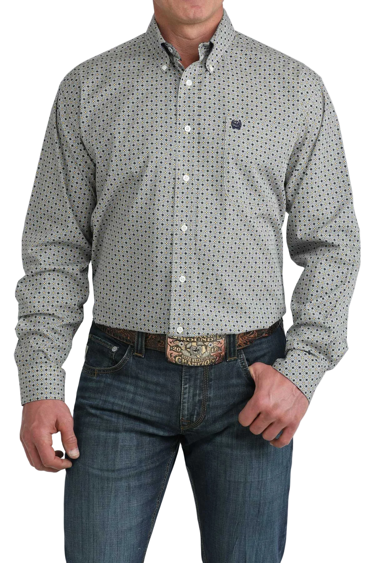 Man wearing a patterned shirt and jeans on a white background