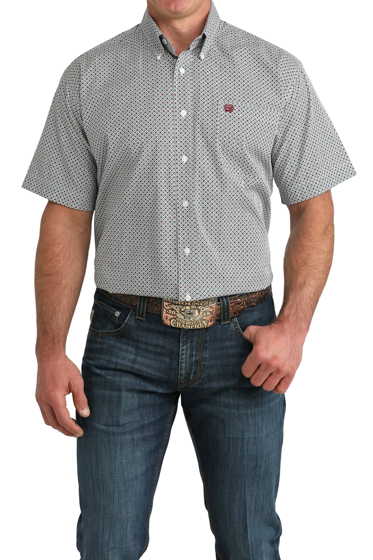 Man wearing a patterned short-sleeve shirt and jeans on a white background