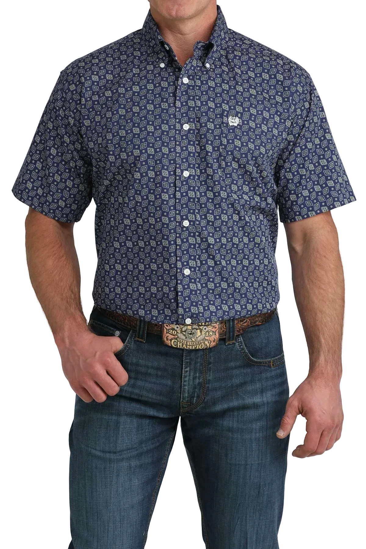 Man wearing a patterned short-sleeve shirt and jeans on a white background