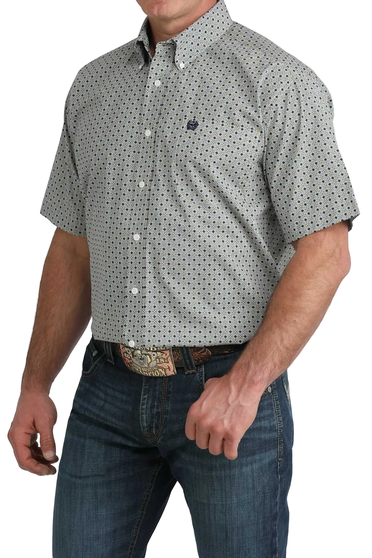 Man wearing a patterned short-sleeve shirt and jeans on a white background