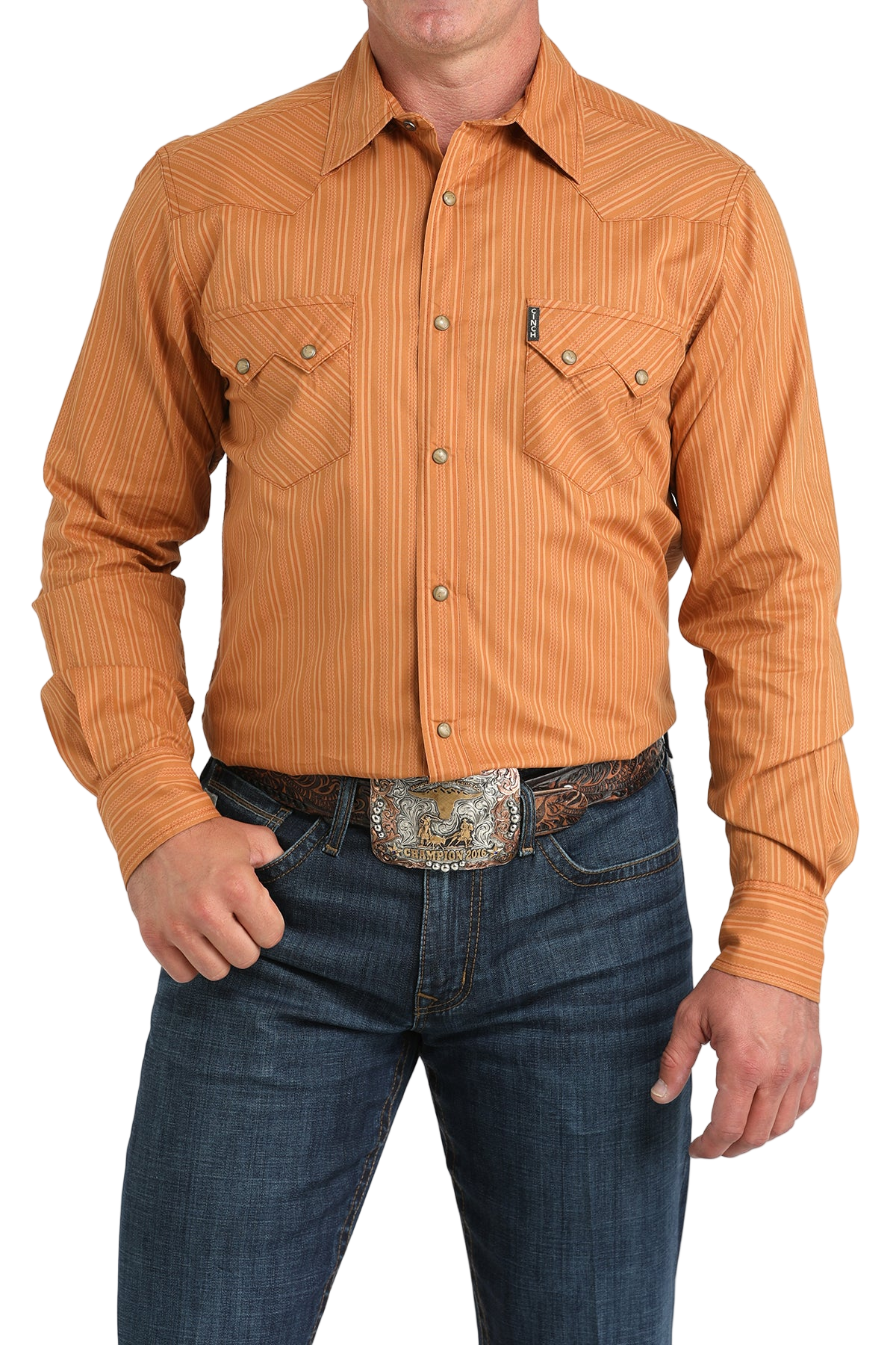 Man wearing a orange button-up shirt with blue jeans on a white background