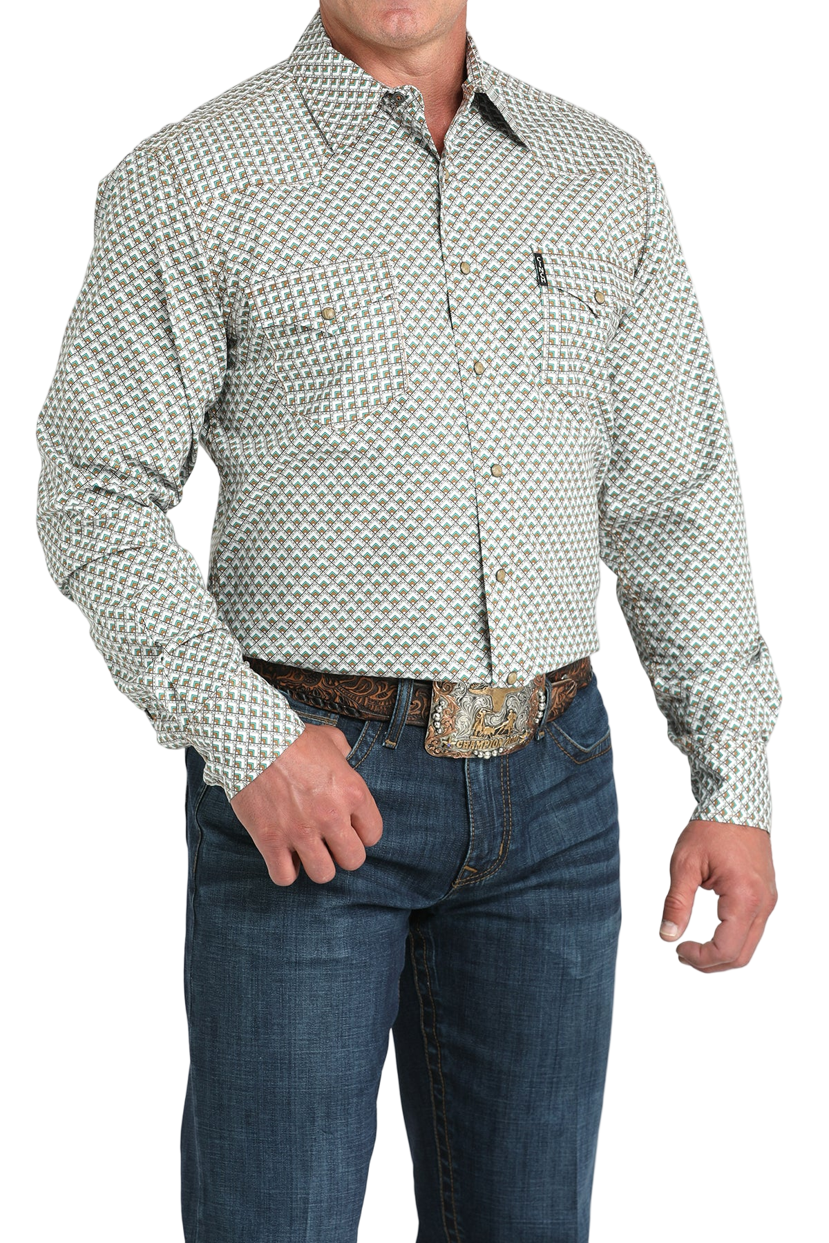 Man wearing a light gray patterned button-up shirt with blue jeans on a white background
