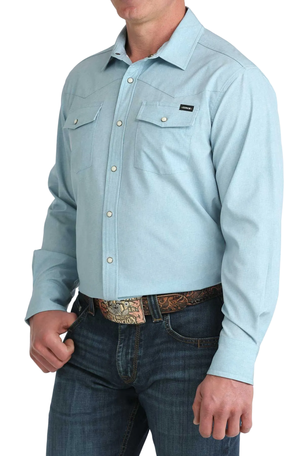 Light blue button-up shirt worn by a person on a white background