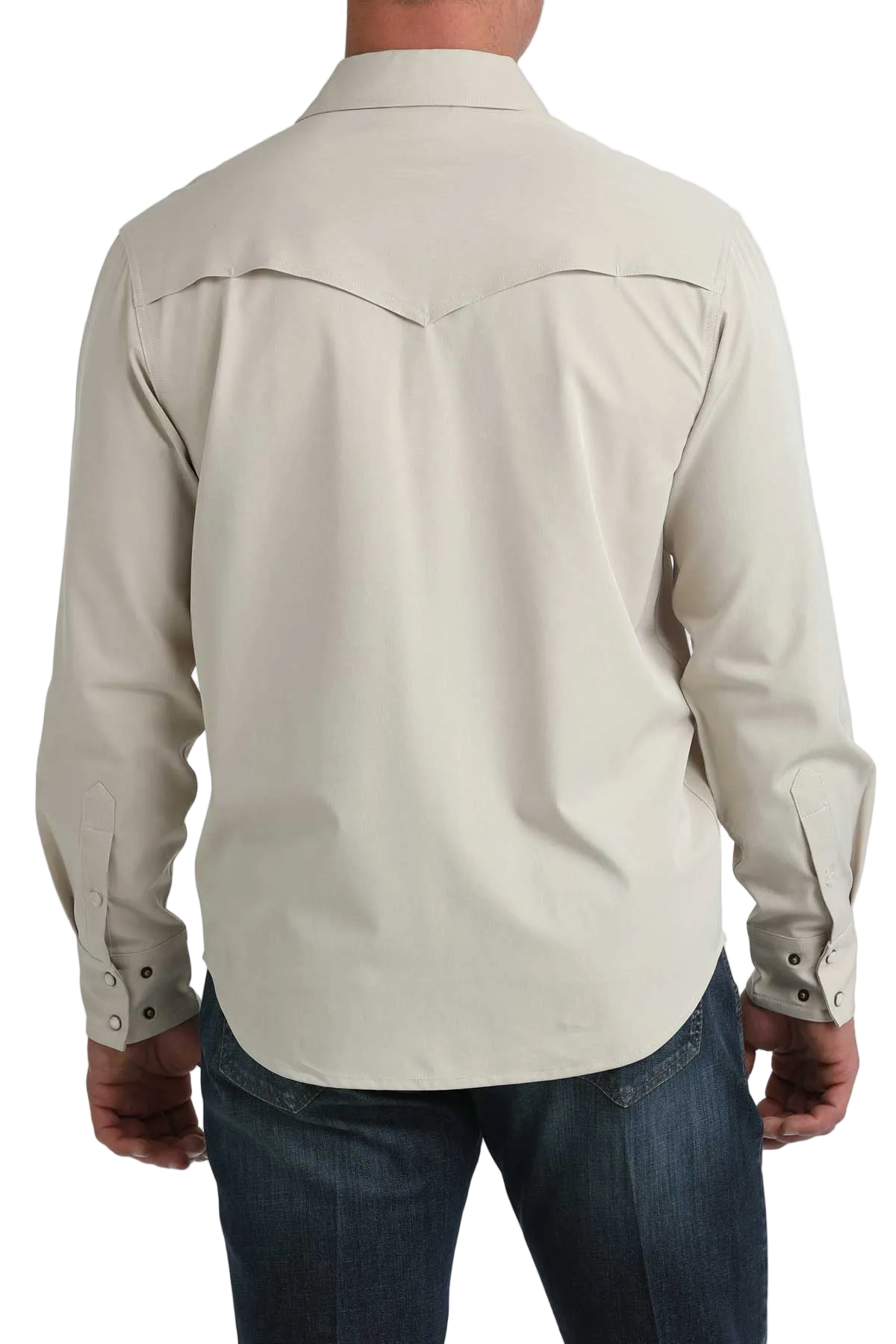 Beige long-sleeve shirt worn by a person on a white background