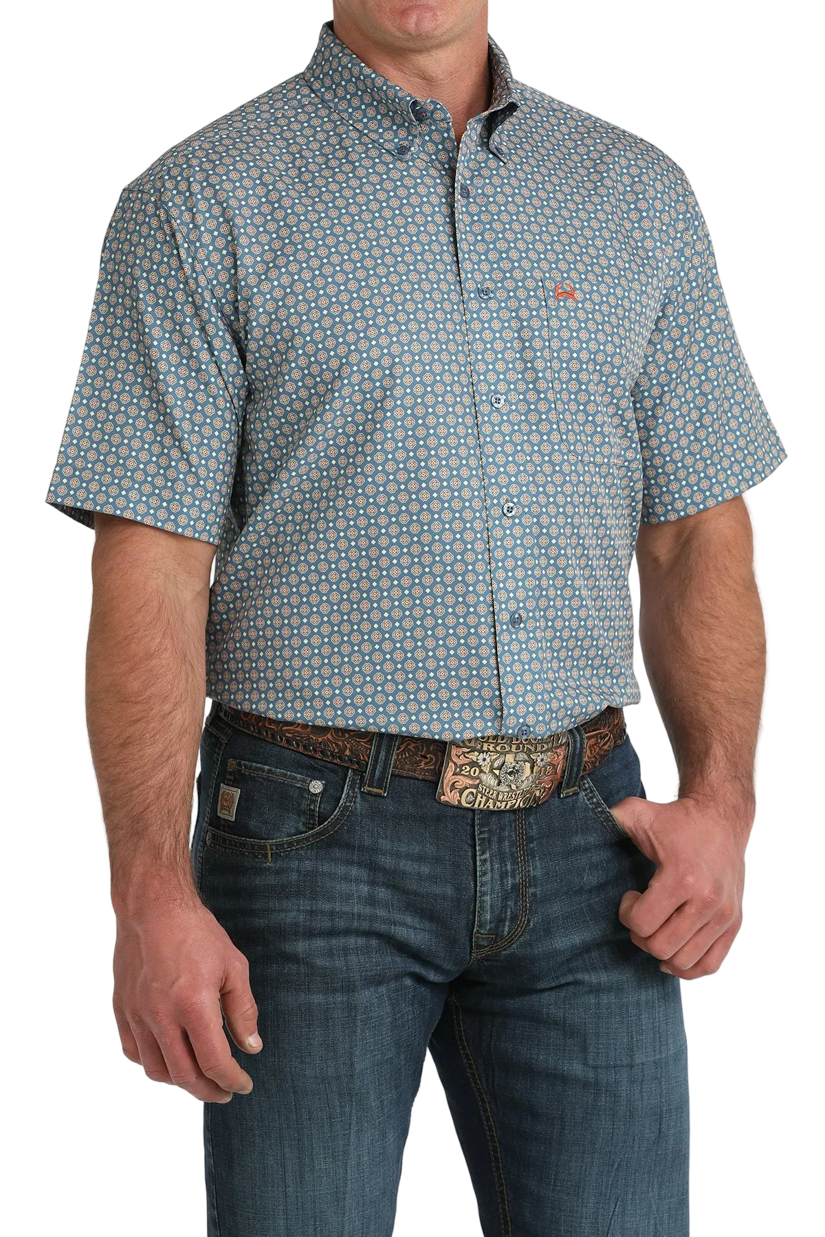 Man wearing a patterned short-sleeve shirt and jeans on a white background